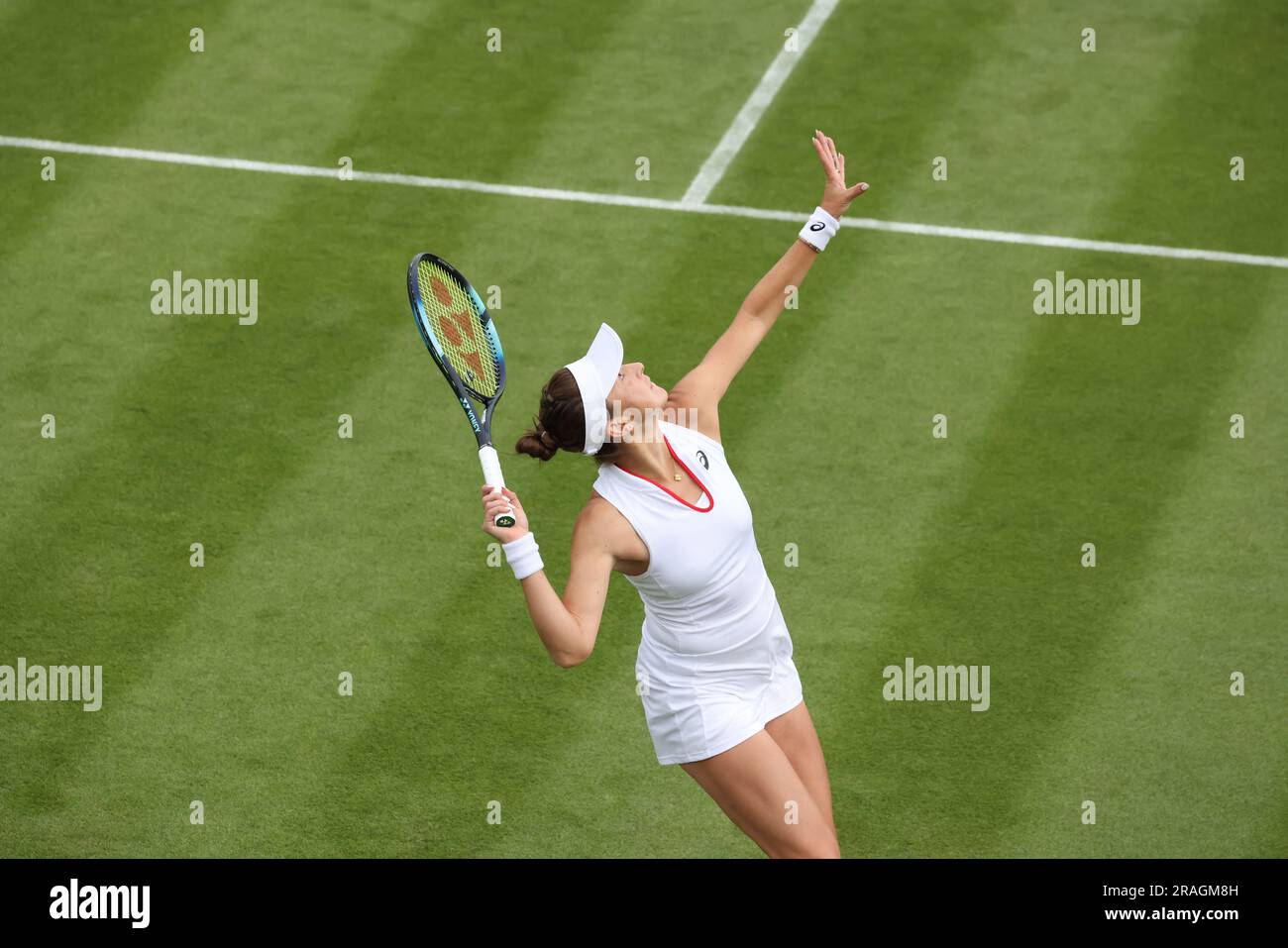 Wimbledon. Belinda Bencic of, Switzerland. 03rd July, 2023. serving to Katie Swan of the United States during their first round match against during opening day at Wimbledon. Credit: Adam Stoltman/Alamy Live News Stock Photo
