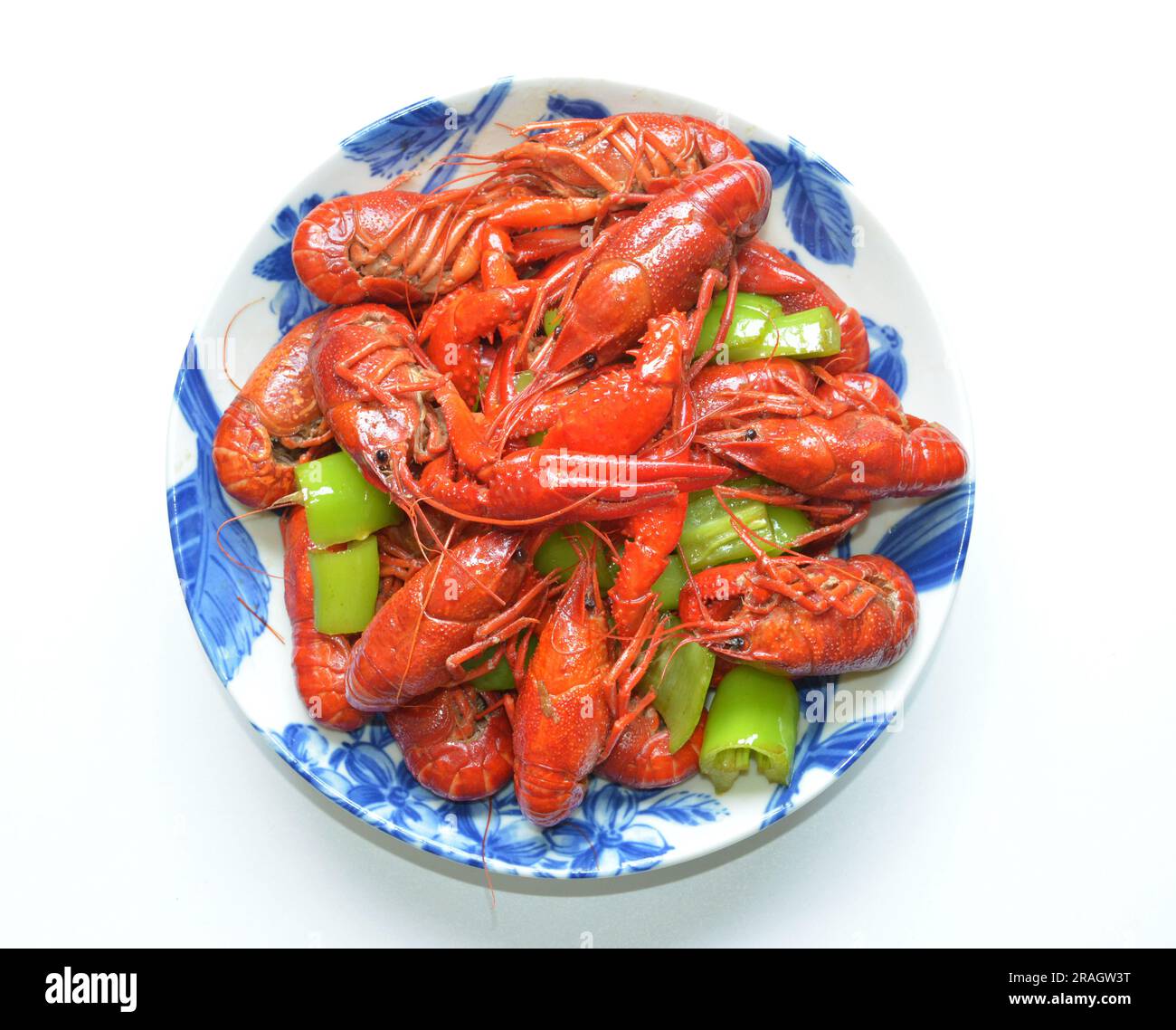 fresh braised crayfish with green pepper in a plate ready for eating Stock Photo