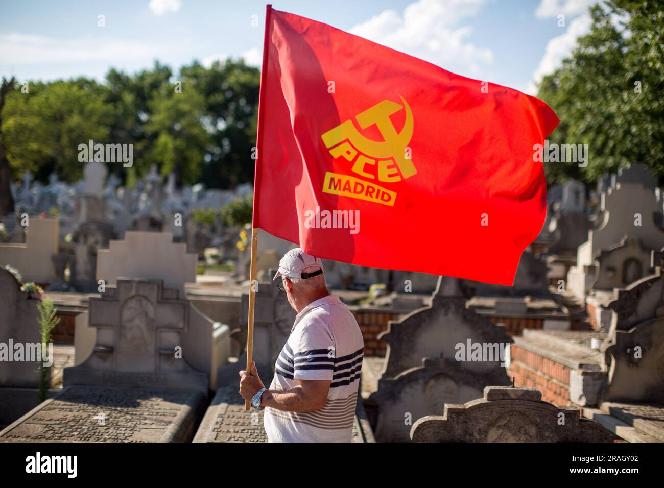 Members of the Portuguese Communist Party Youth carry flags and