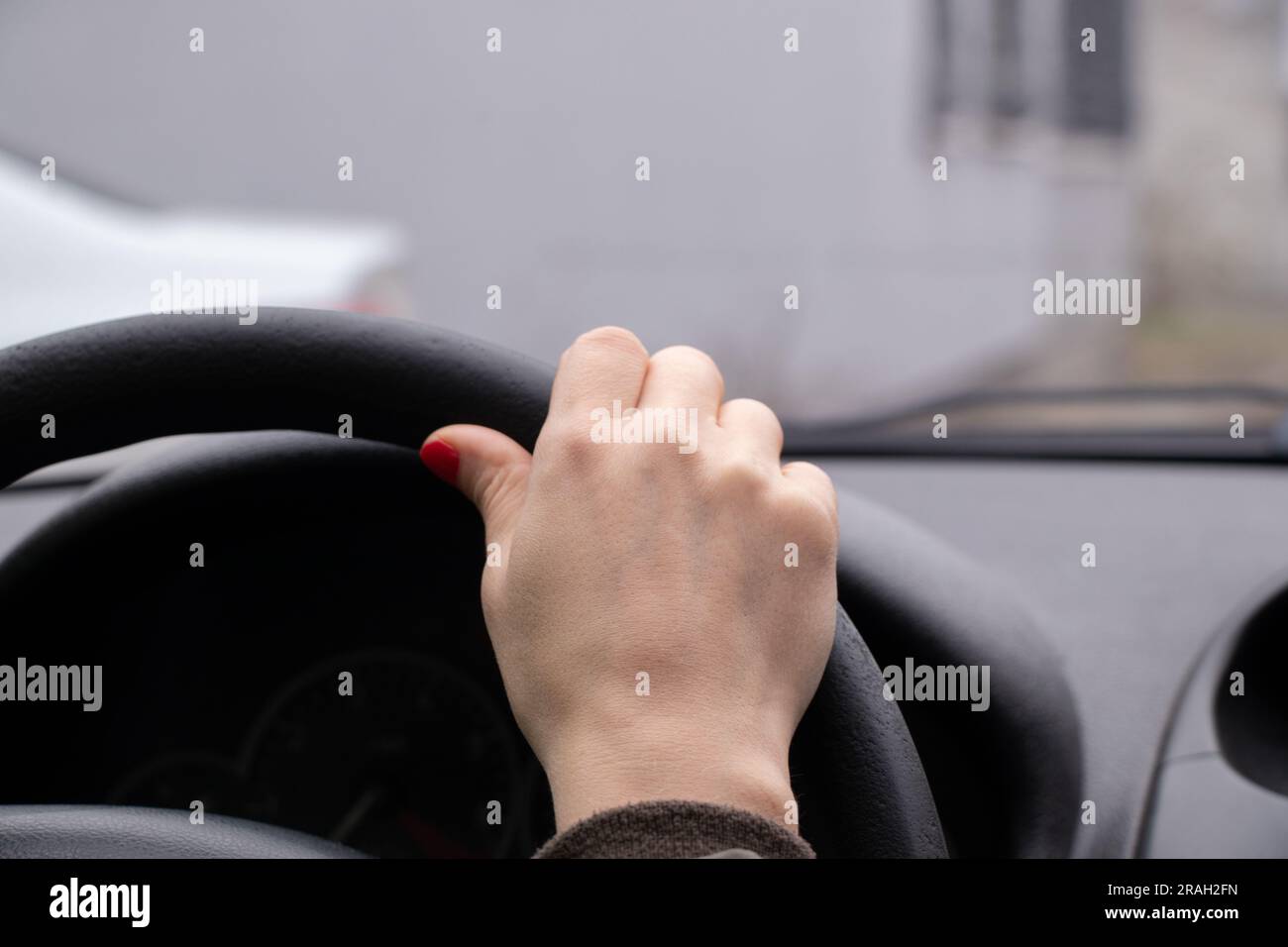 Woman hands on steering wheel hi-res stock photography and images - Alamy