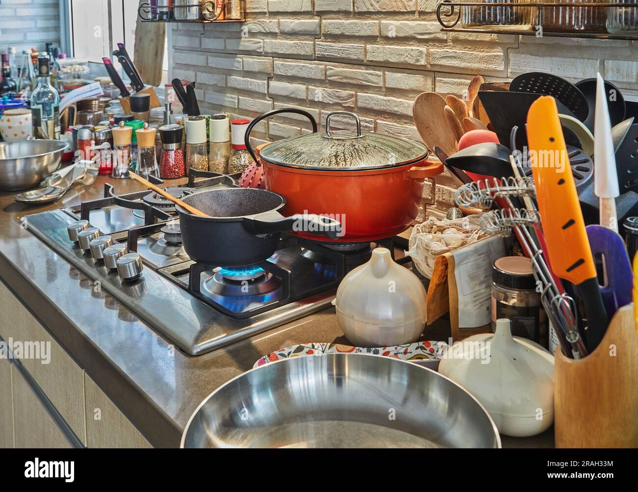 Pots with cooking food in the kitchen on gas stove Stock Photo - Alamy