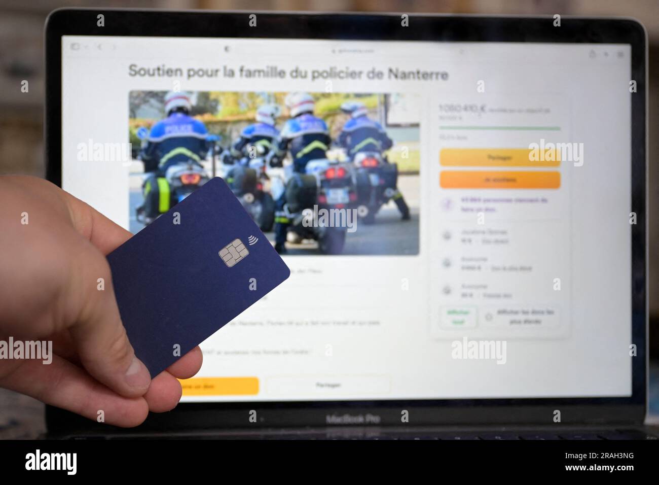 A view of GoFundMe fund to support police officer Florian M. A row has broken out over a collection for the family of the French police officer under investigation for shooting dead a 17-year-old that has topped more than € 1m in donations. A similar collection to help the family of the victim, Nahel M, killed a week ago in Nanterre outside Paris after being stopped by two motorcycle patrol officers, has collected less than € 200,000. The shooting last Tuesday led to a wave of rioting and violence across France and worsened deep political divisions. Protesters clash with riot police in Marseil Stock Photo