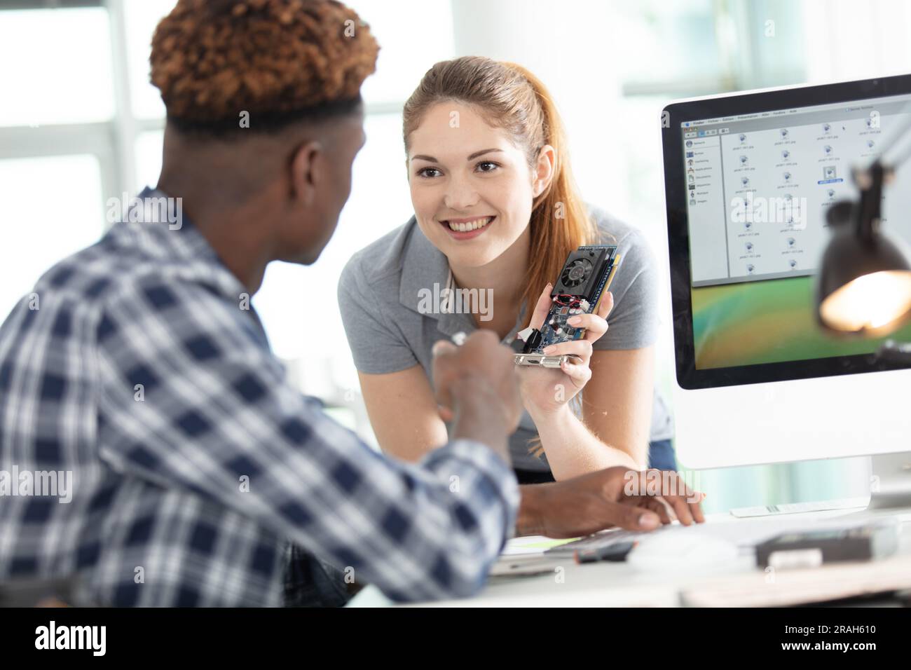 young attractive students of mechatronics working on project Stock Photo