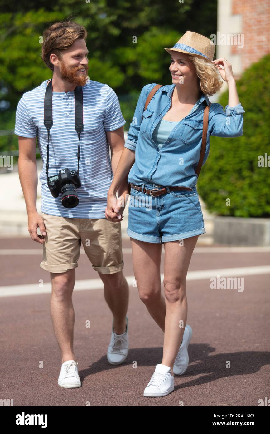 couple holding hands during walking on the street Stock Photo - Alamy