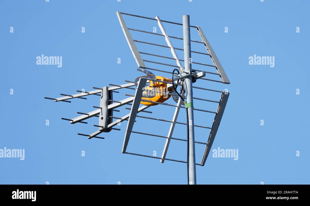 TV Antenna on the roof. Aerial installed to the roof. Receiving tv signals. Tv and internet connection aerial. Stock Photo