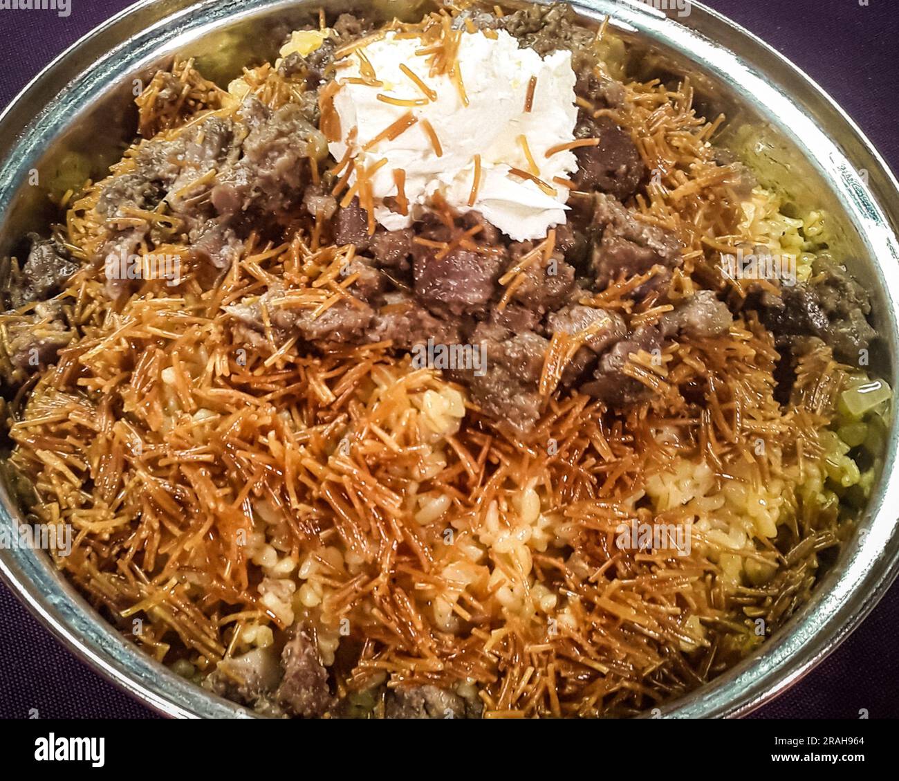 Bulgur pilaf with noodles, cream and lamb meat. Traditional Turkish