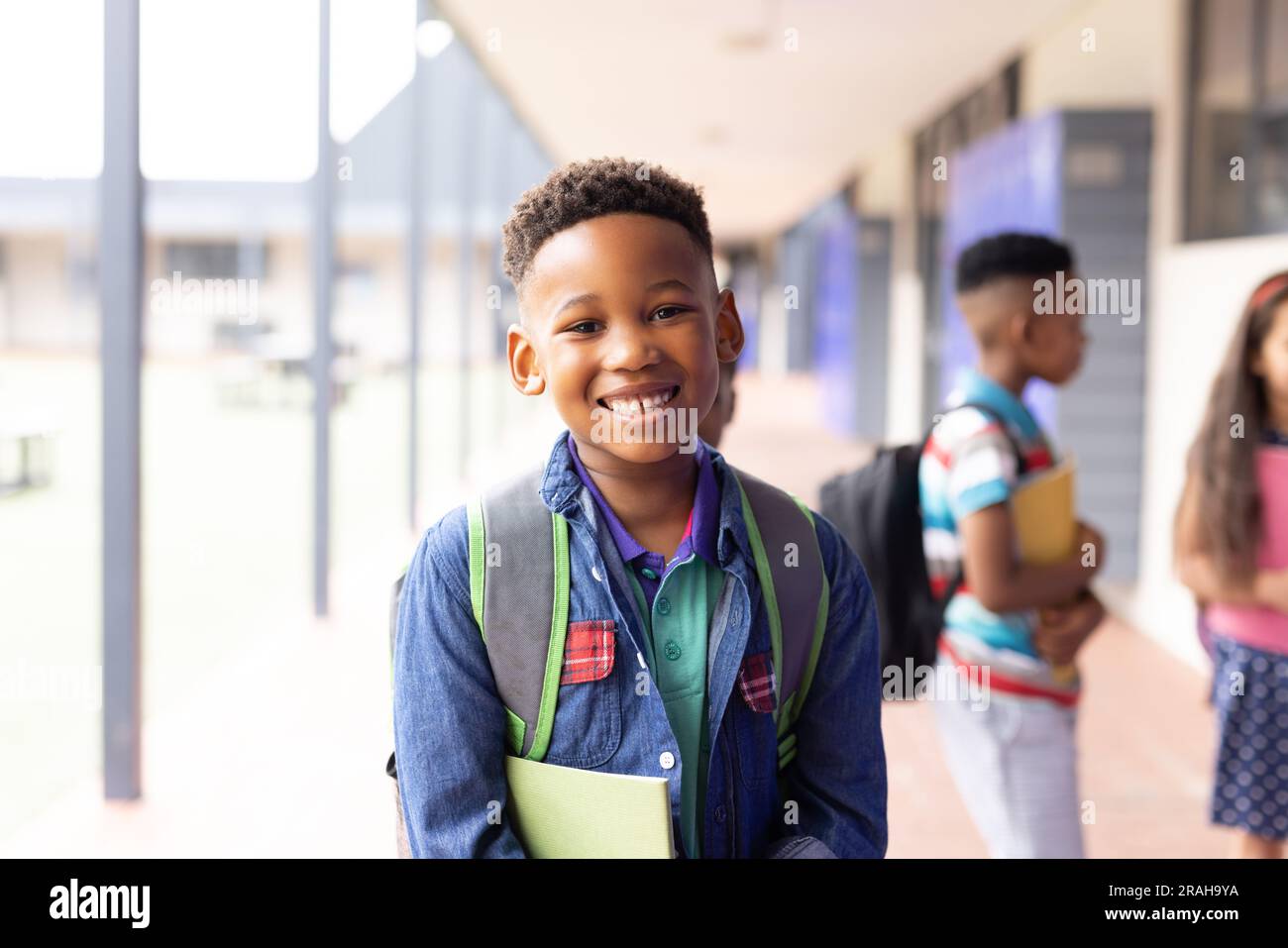 Portrait of smiling african american schoolboy in elementary school ...
