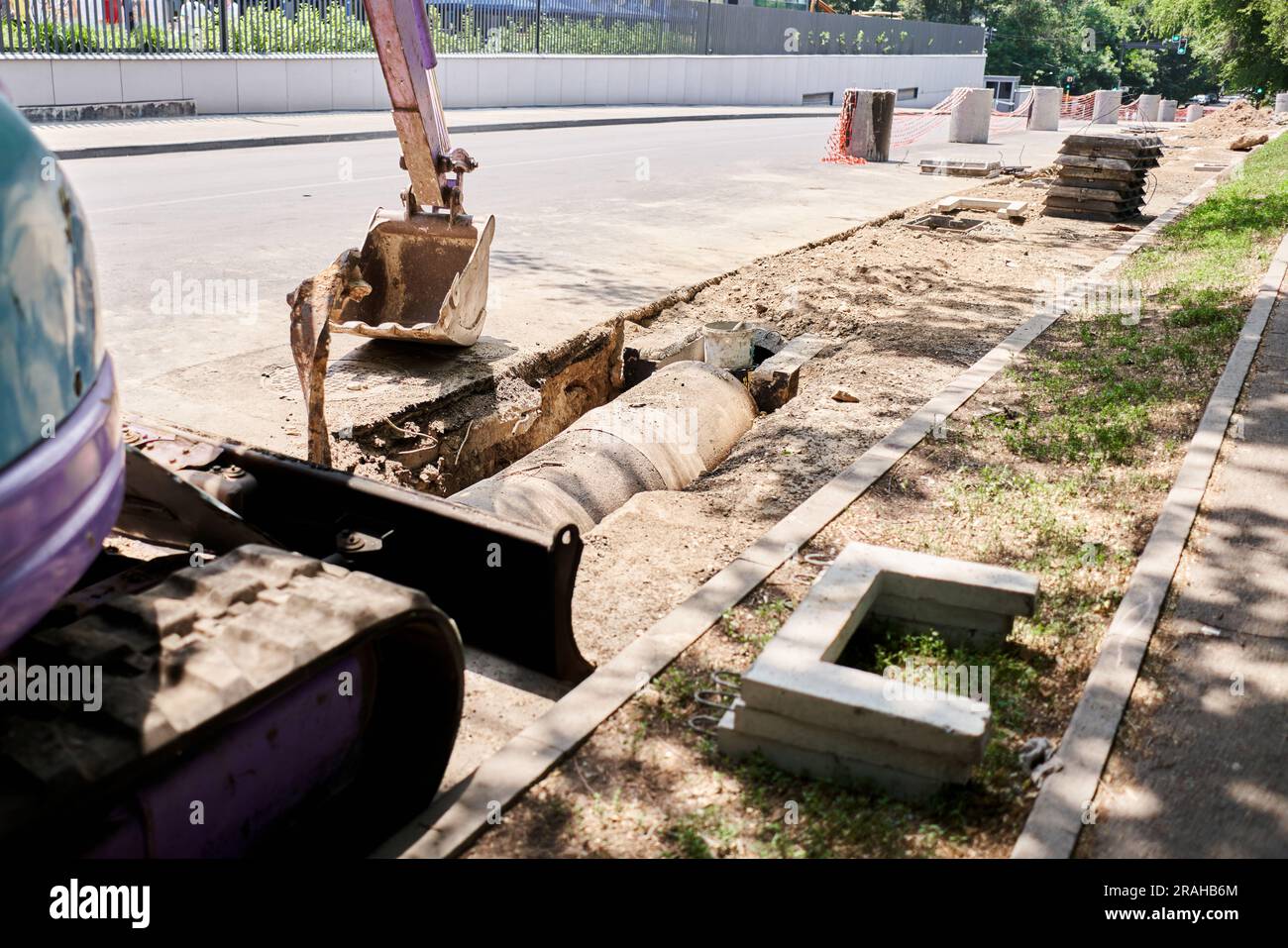 Big jackhammer drill drilling road.Heavy machinery crushing asphalt for