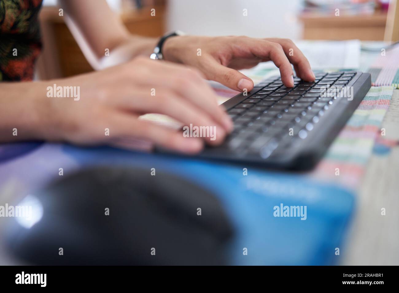 Young man software developer working from home on his laptop Stock Photo