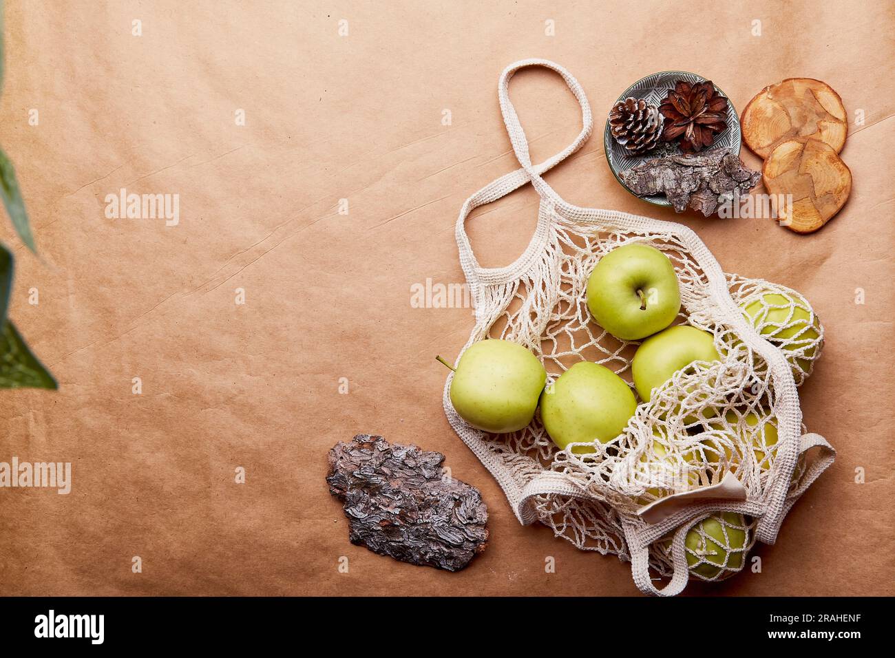 Eco-friendly, zero waste, sustainable lifestyle flat lay with copy space. Natural background with tree bark and apples on crafting paper Stock Photo