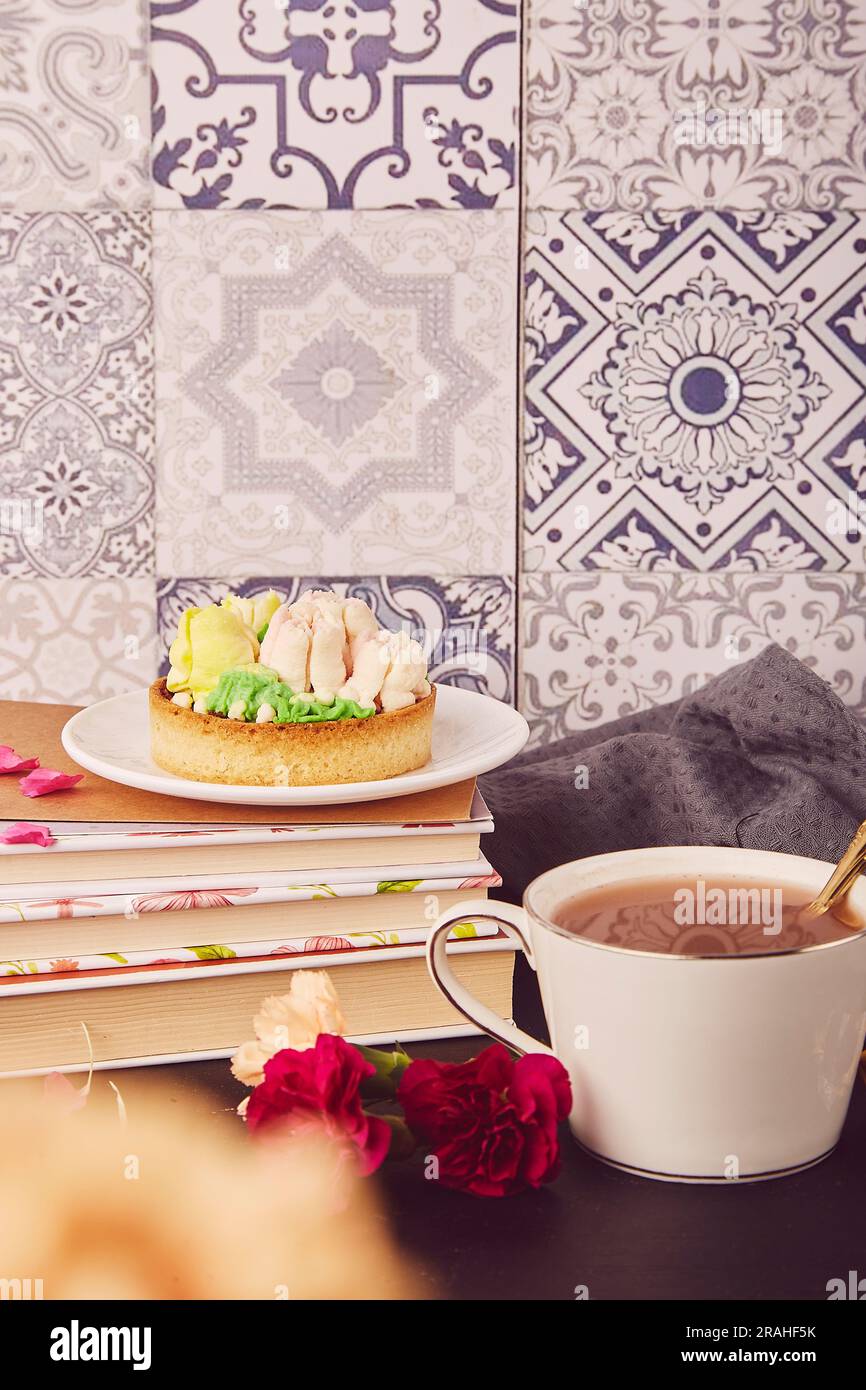 Hygge home aesthetic. Floral french tart with flowers. Ceramic tile