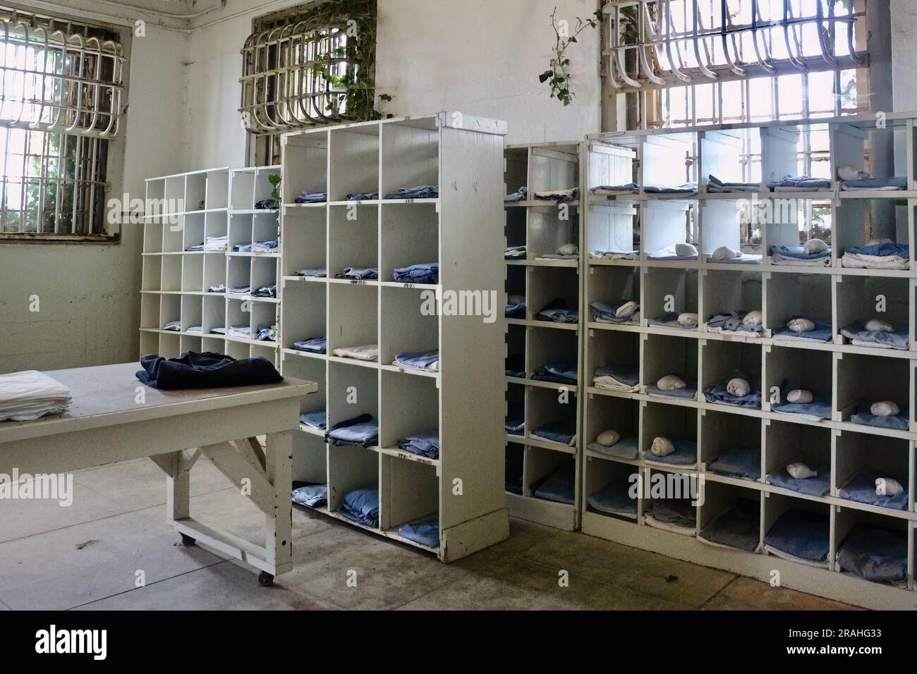 Laundry room with shelves of uniforms and linen Alcatraz Federal Penitentiary Alcatraz Island San Francisco California USA Stock Photo