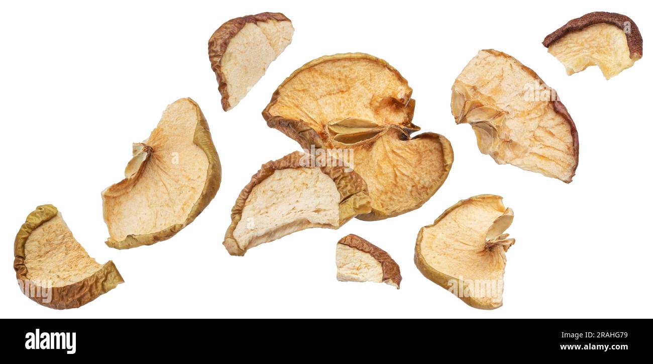 Falling dried apple slices isolated on white background Stock Photo