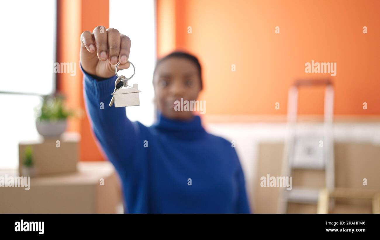 African american woman holding new house keys at new home Stock Photo ...