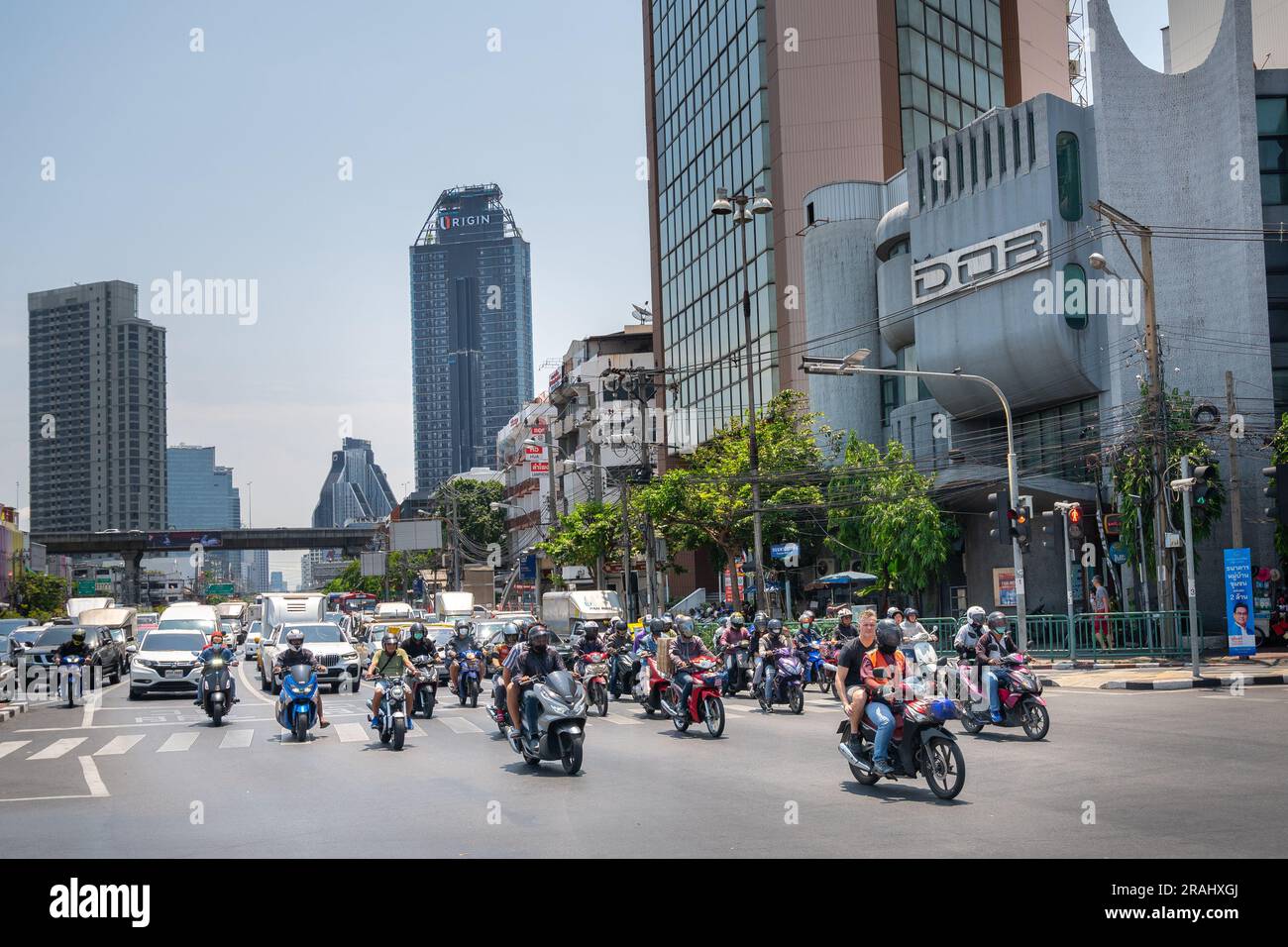 Scooters and bikes are one of the most common modes of transport in Bangkok Stock Photo