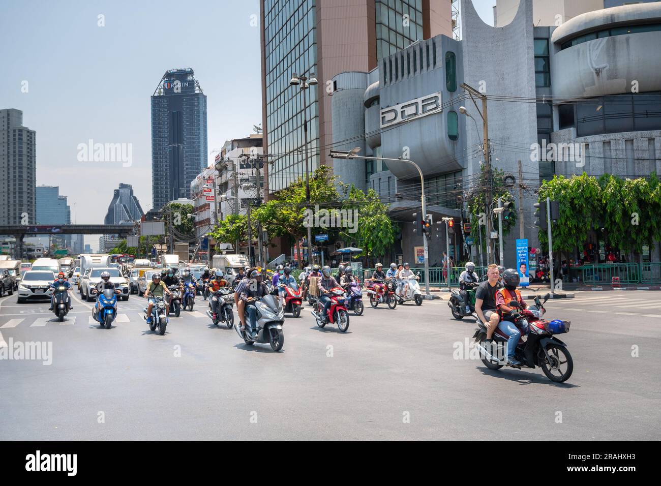 Scooters and bikes are one of the most common modes of transport in Bangkok Stock Photo