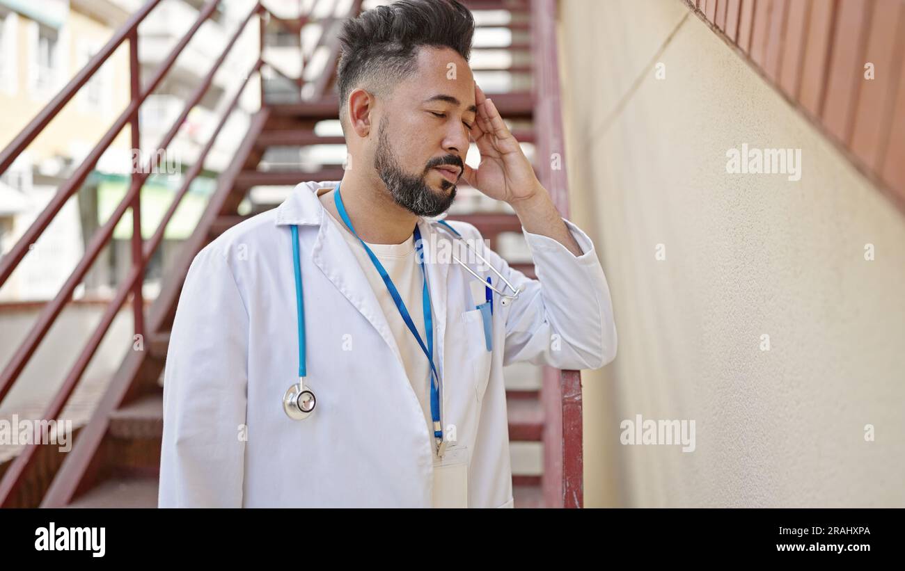 Young latin man doctor stressed hi-res stock photography and images - Alamy