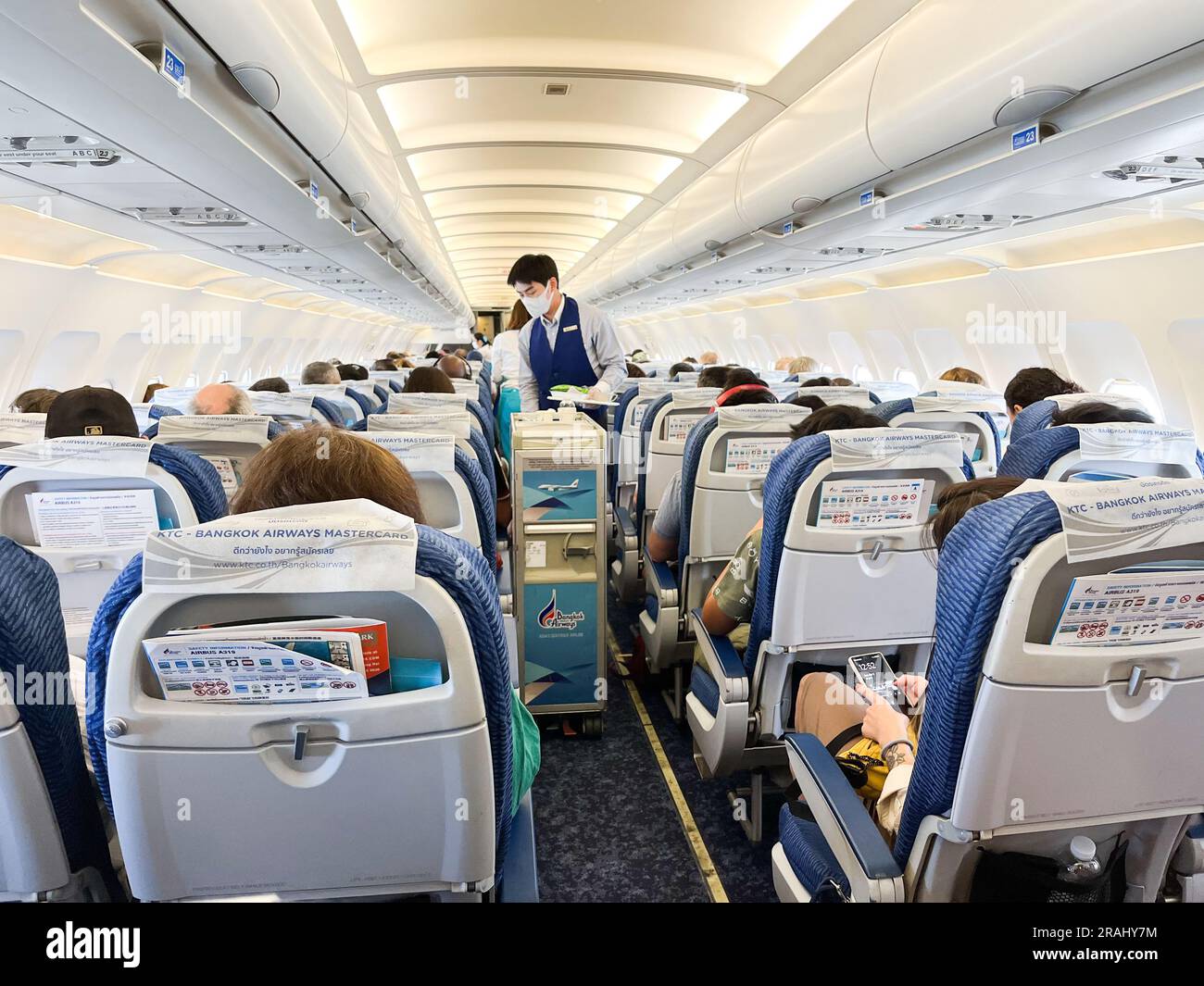 Inside economy section of Bangkok Airways flight from Bangkok, Thailand ...