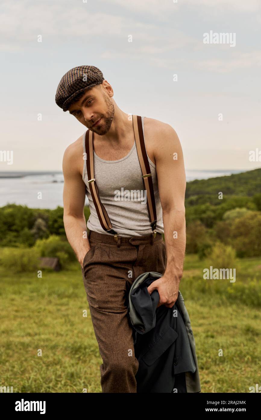 Portrait of fashionable and bearded man in newsboy cap and vintage ...