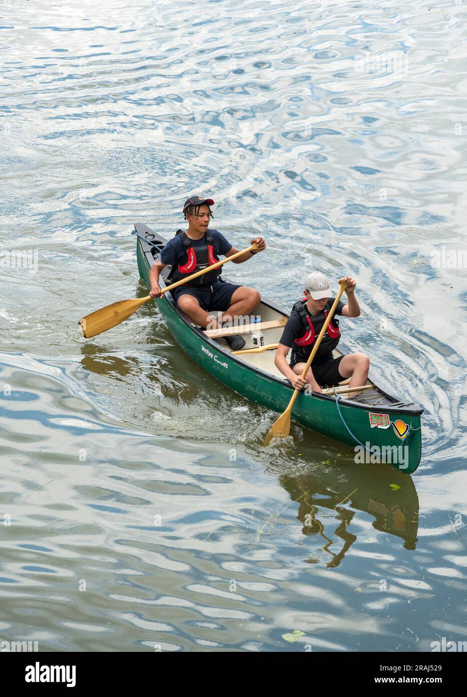 Two sea cadets in Venture canoe on Brayford Pool, Lincoln City, Lincolnshire, England, UK Stock Photo