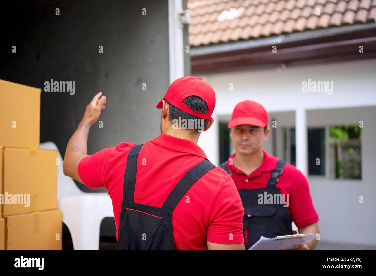 Delivery man move items to the house. Service and delivery concept