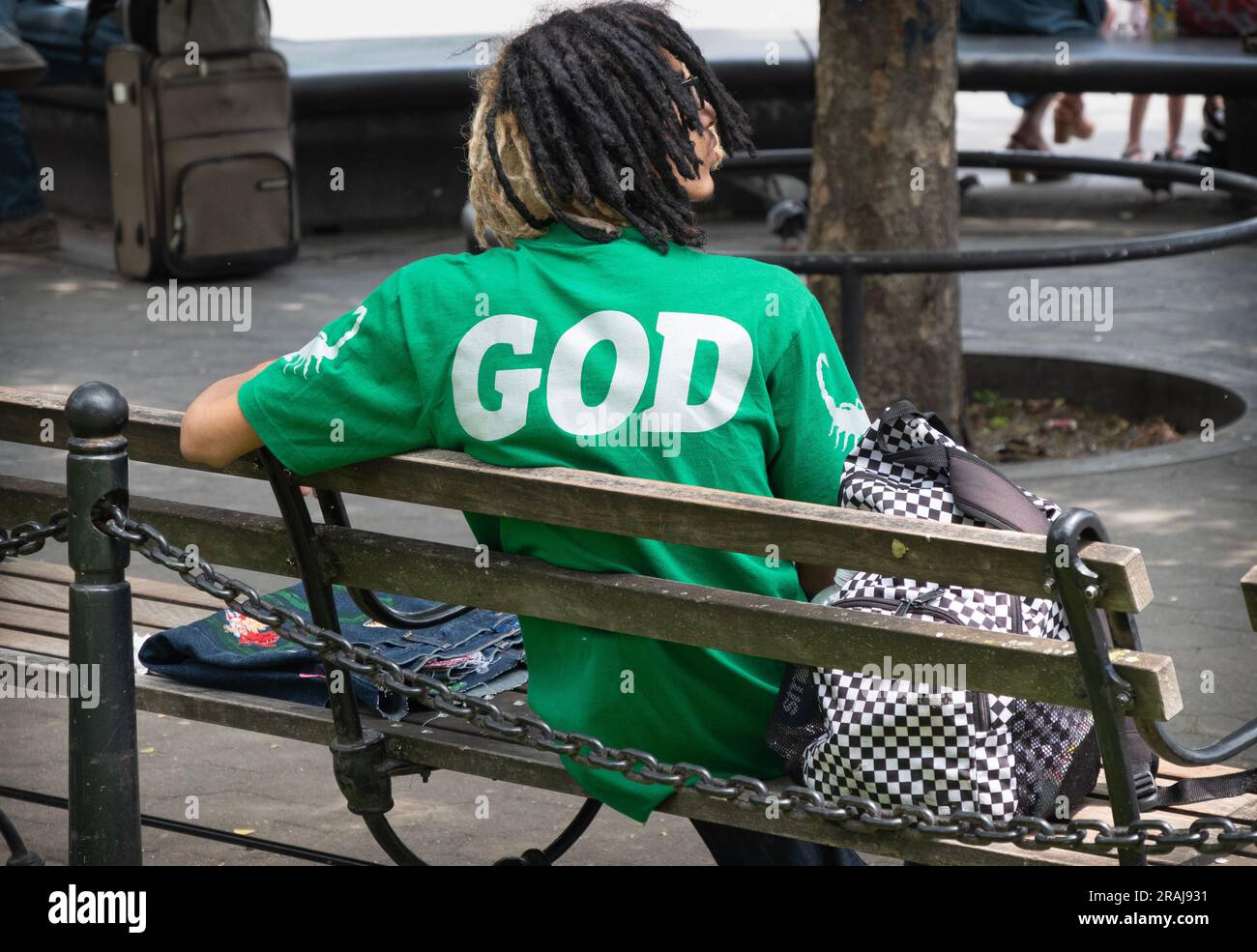 A young man who seems to think he is God. In a park in Greenwich Village, Manhattan. Stock Photo