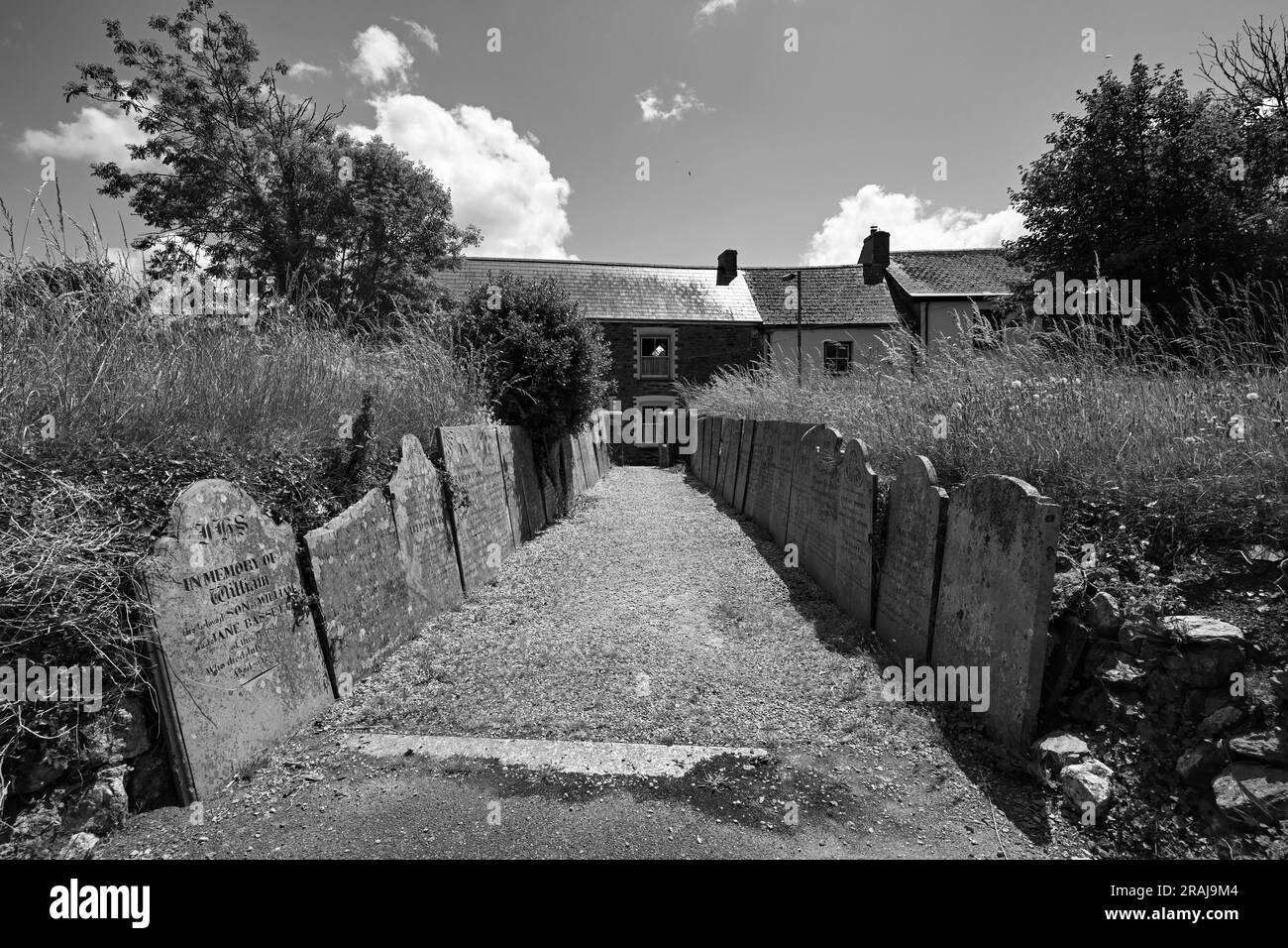ST NEWLYN EAST CHURCH AND GRAVE YARD WITH HEADSTONES AND PATH LINE WITH