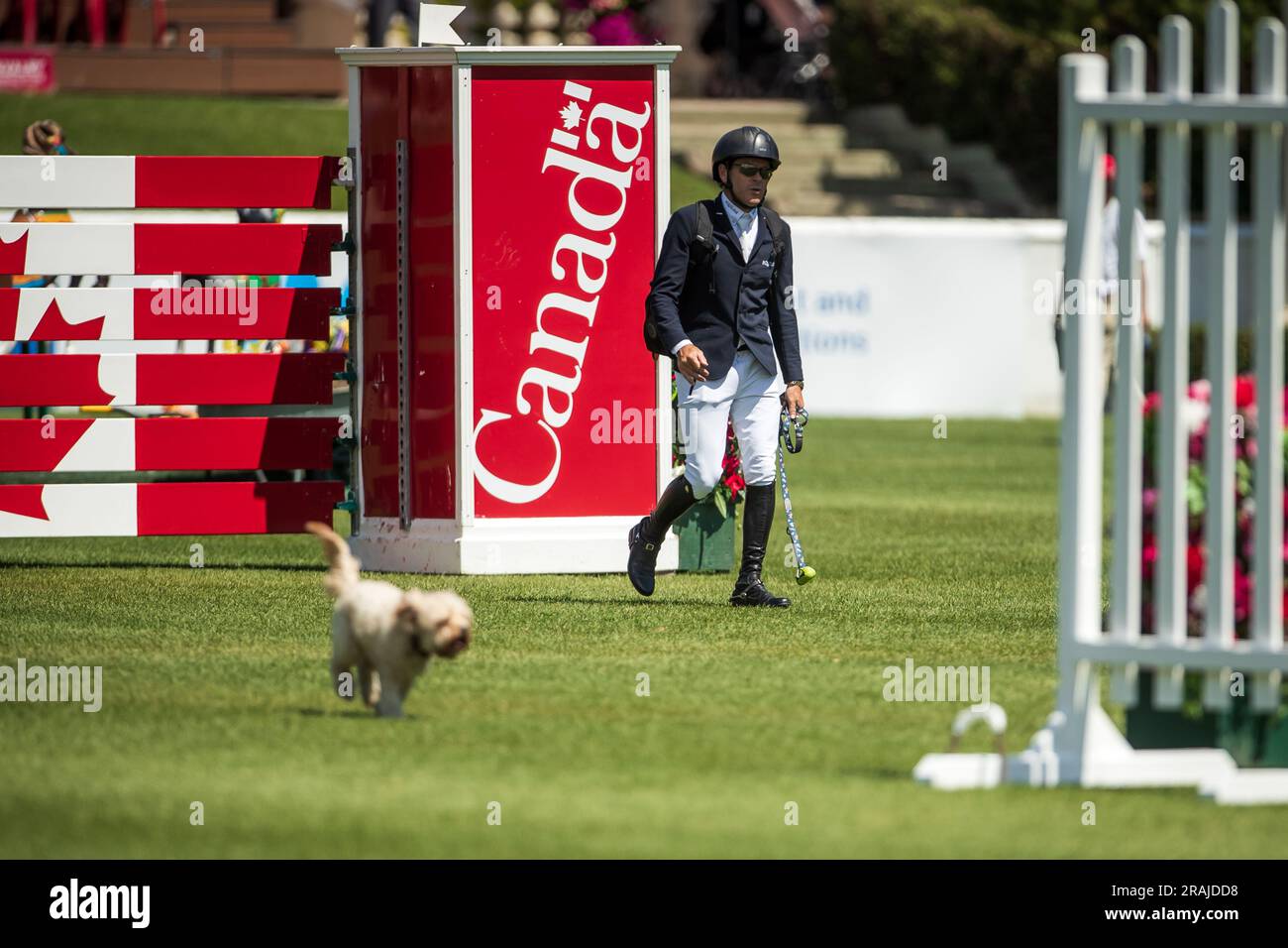 Conor Swail and his dog Ralph walk the course ahead of the Rolex Pan ...