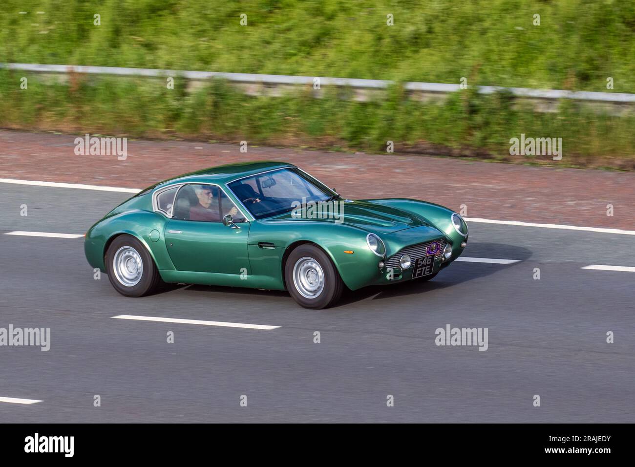 2001 Tribute Z3gato Z Series Green Petrol 2979 cc roadster, body conversion kit car;  travelling at speed on the M6 motorway in Greater Manchester, UK Stock Photo