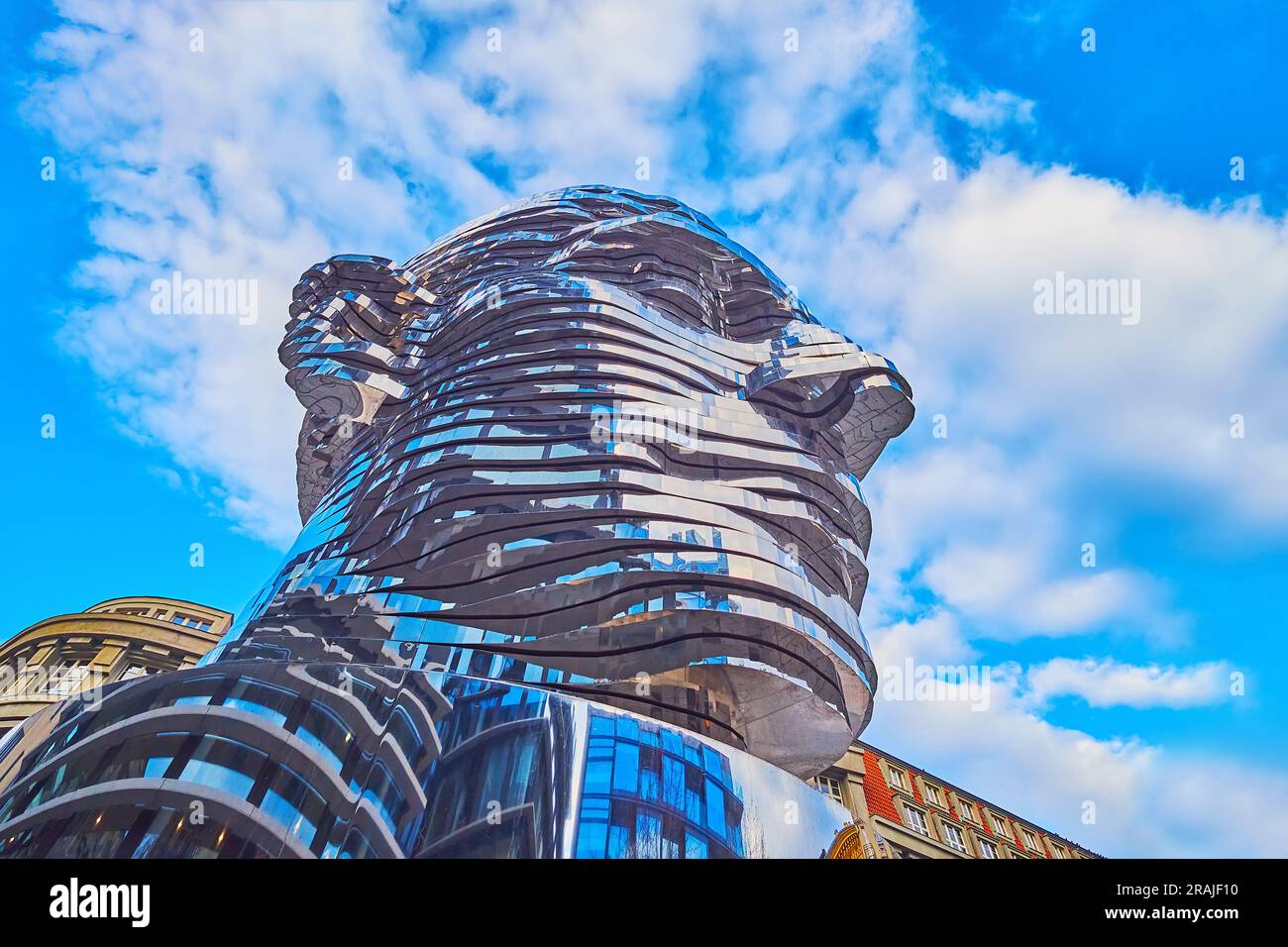 PRAGUE, CZECHIA - MARCH 7, 2022: The worms eye view of the moving statue of Franz Kafka's head by David Cerny, on March 7 in Prague Stock Photo