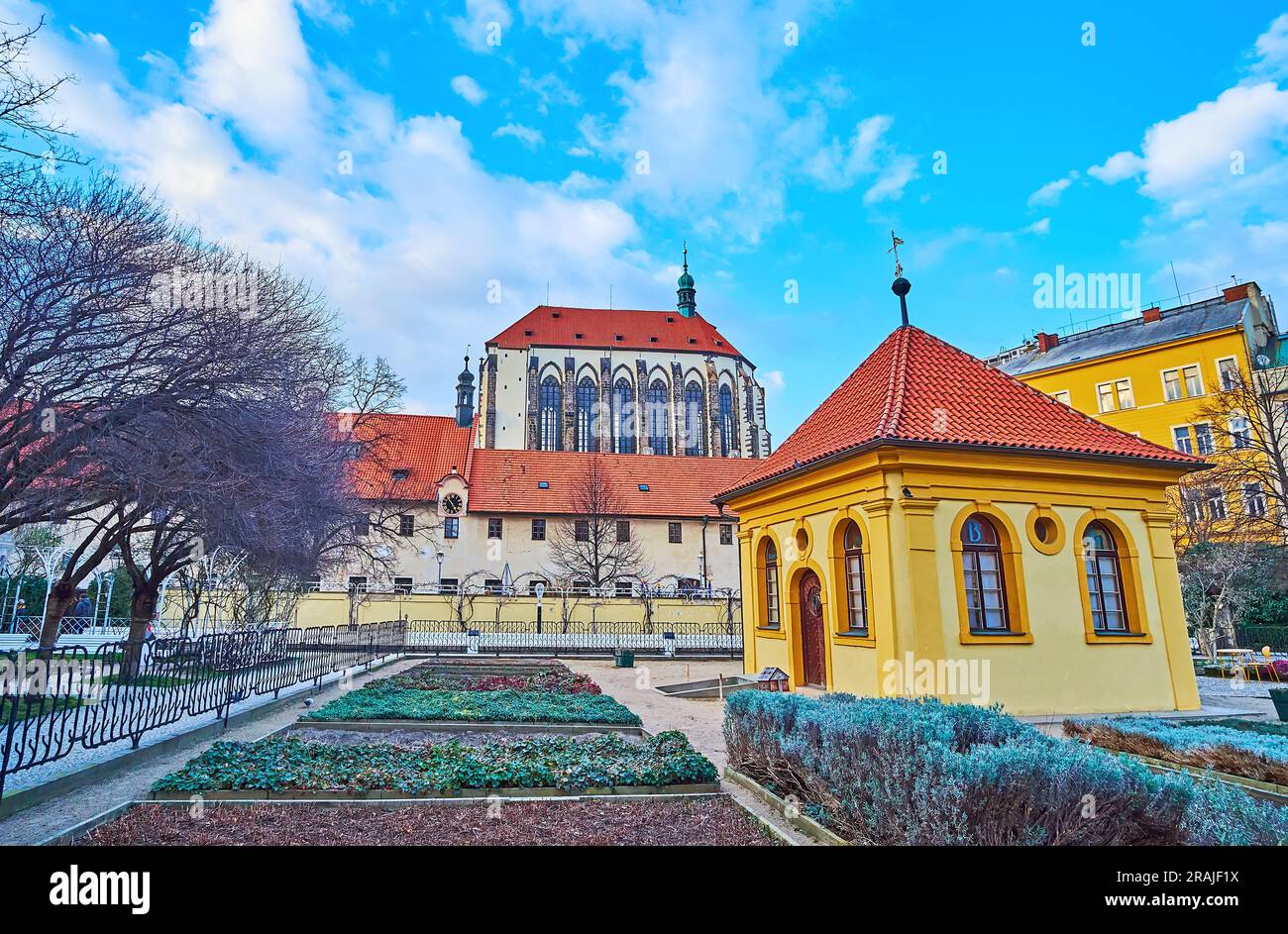 The medieval Our Lady of the Snows Church with herbs garden of the Franciscan Garden with small gazebo in the foreground, Prague, Czechia Stock Photo