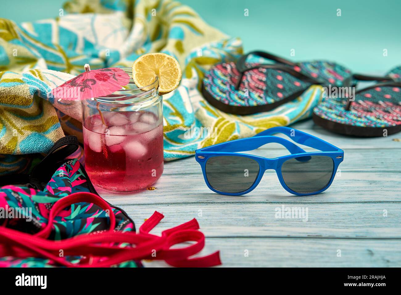 Refreshing summer drink with lots of ice an umbrella and a slice of ...