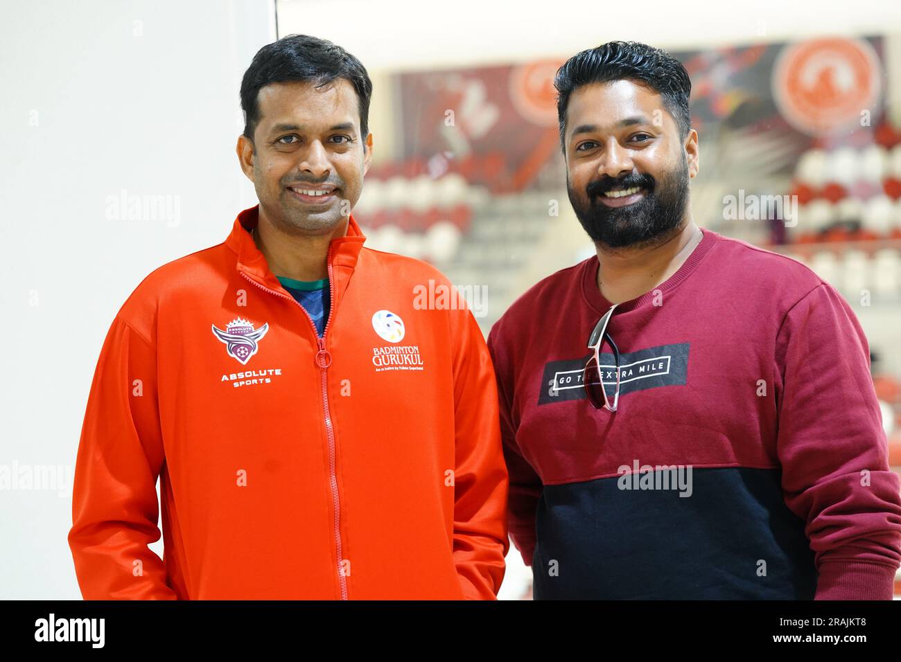 Indian badminton legend Pullela Gopichand poses for a picture with a Indian physical education teacher based in Qatar durng his visit to Qatar. Stock Photo