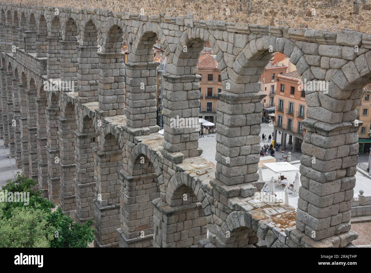 Roman aqueduct, detail of the stone arches of the magnificent 1st Century AD Roman aqueduct spanning the centre of the city of Segovia, Spain Stock Photo