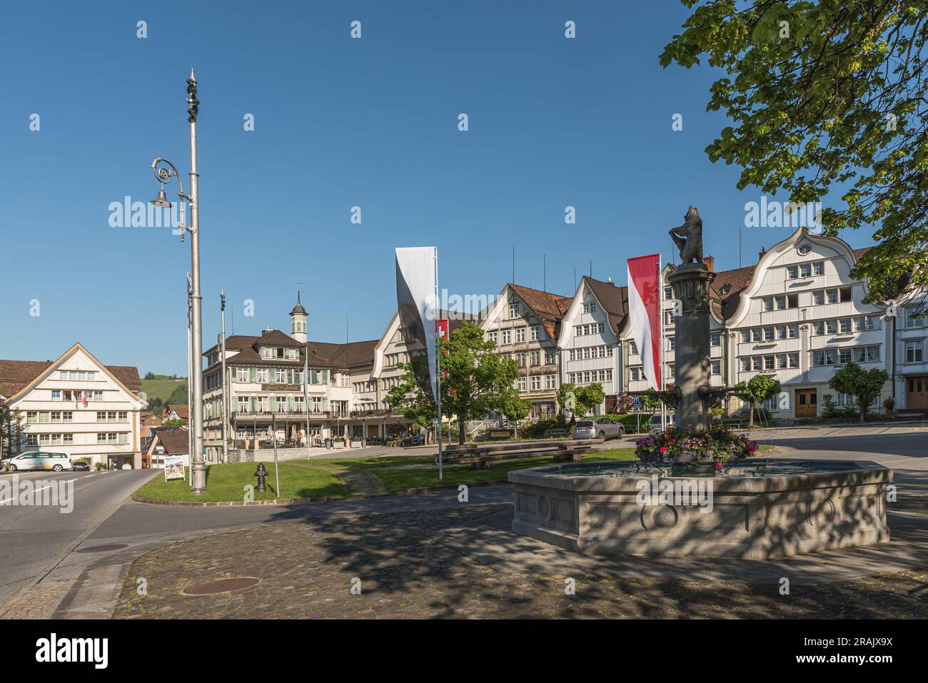Village square with fountain and traditional Appenzell wooden houses with curved gables, Gais, Appenzell Ausserrhoden, Switzerland Stock Photo