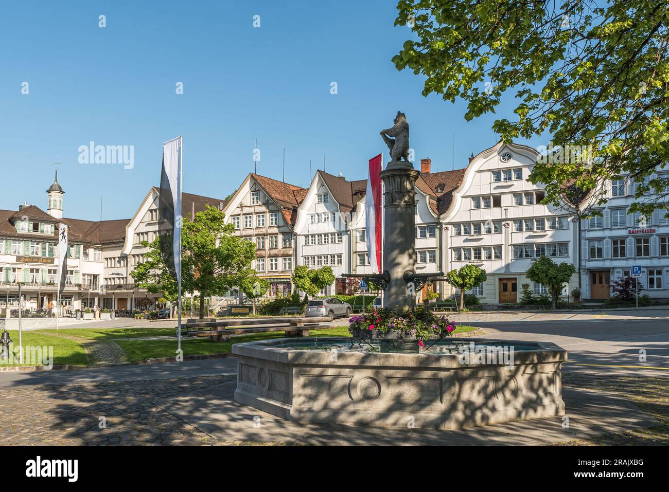 Village square with fountain and traditional Appenzell wooden houses with curved gables, Gais, Appenzell Ausserrhoden, Switzerland Stock Photo