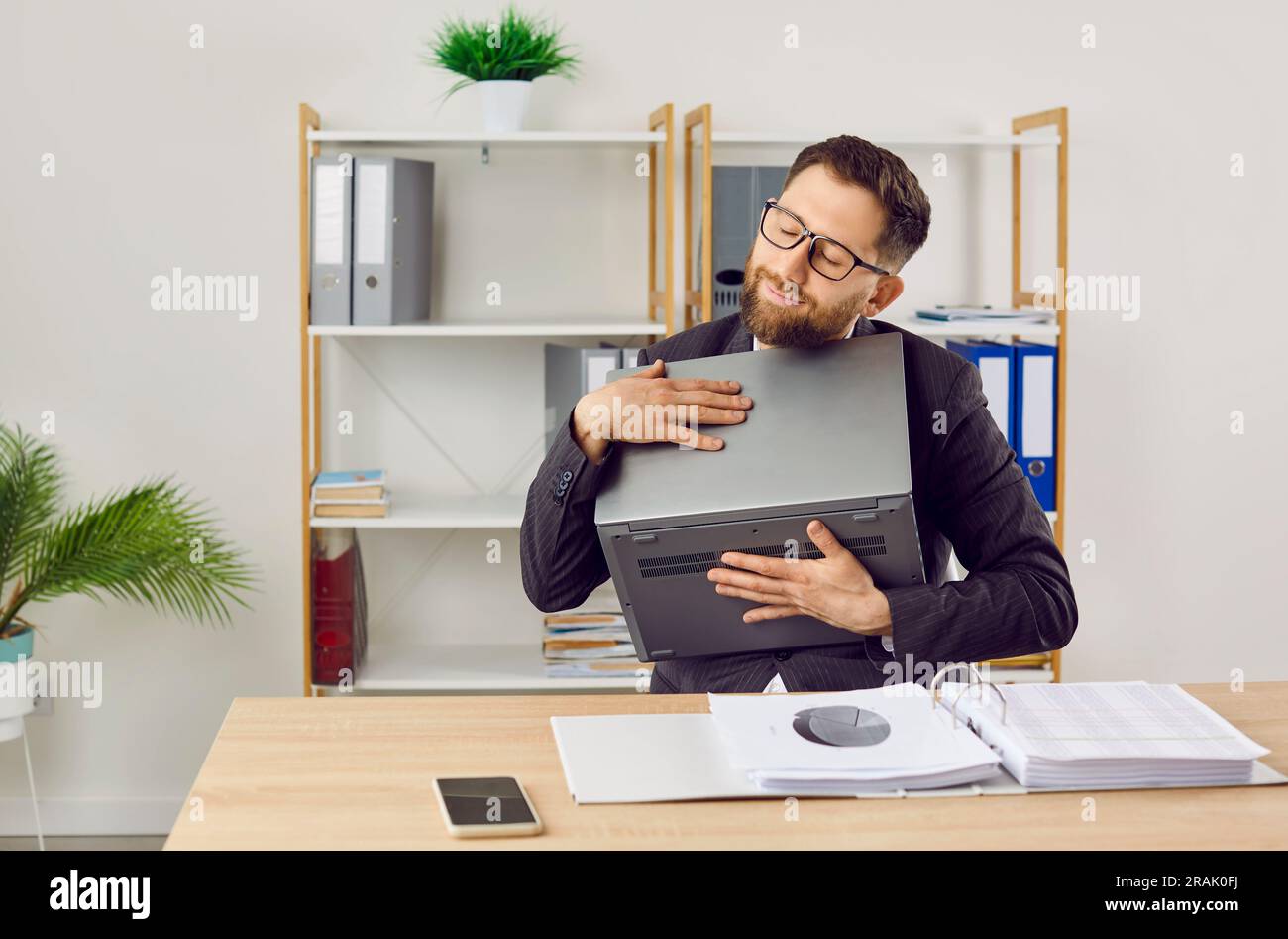 Computer Cannot Hug Funny happy businessman or corporate employee loves and hugs his laptop ...
