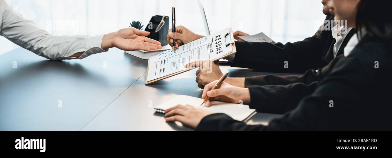 Candidate and interviewers discuss work experience and qualifications