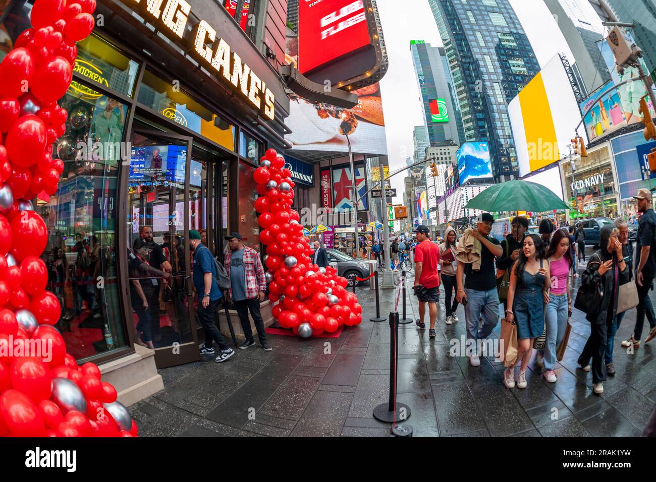 Hordes of chicken finger lovers flock to the grand opening of Raising CaneÕs Global Flagship Store in Times Square in New York on Tuesday, June 27, 2023. The Louisiana based fast food chain serves only chicken finger meals with accompanying sides and plans to open 25 locations in New York City within the next three years. The chain has over 740 restaurants in 36 states, the Middle East and the territory of Guam. (© Richard B. Levine) Stock Photo