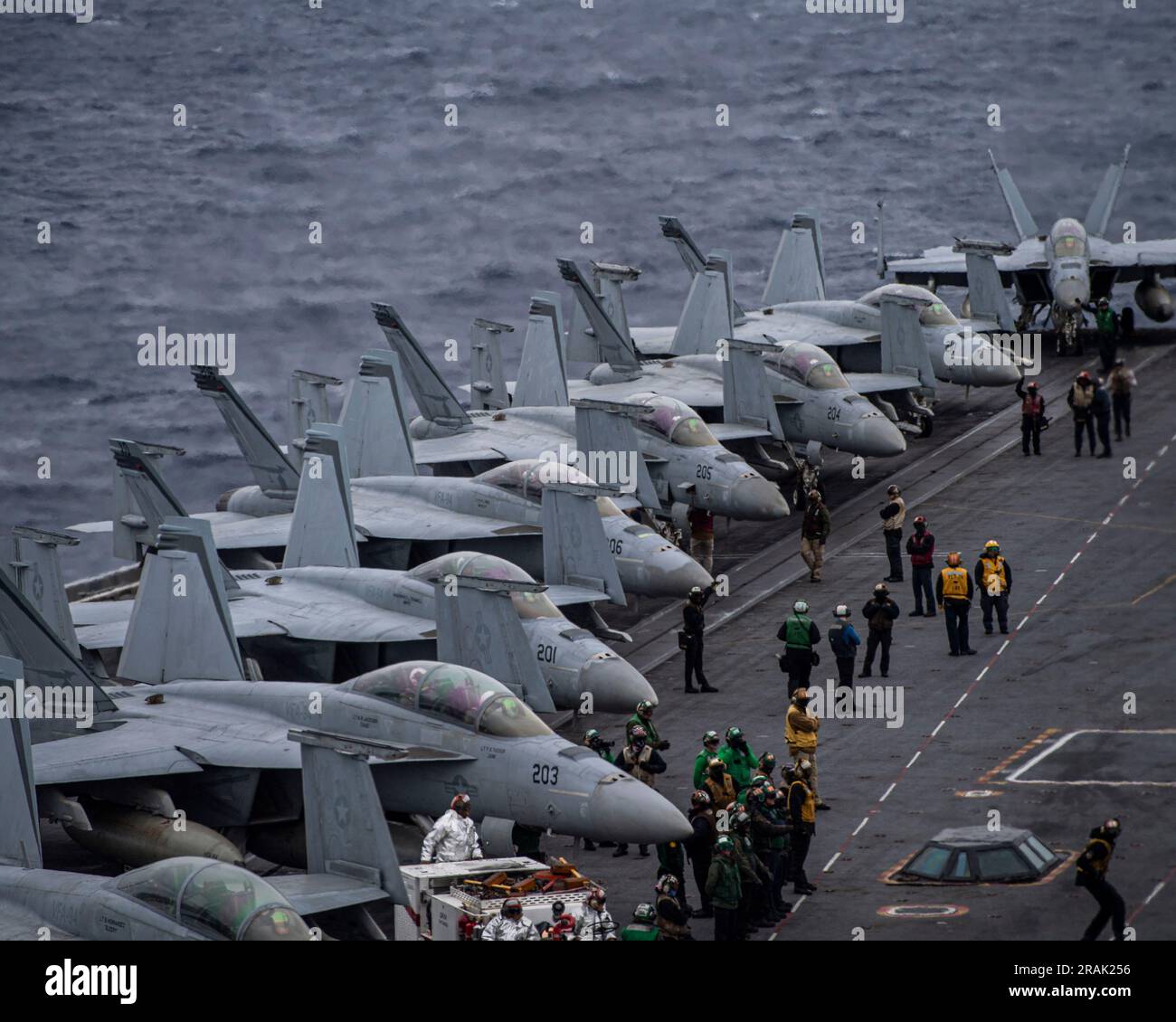 USS Nimitz, United States. 27 June, 2023. U.S. Navy F/A-18F Super Horner fighter aircraft from the Mighty Shrikes of Strike Fighter Squadron 94, are lined up and readied for flight operations on the flight deck of the Nimitz-class aircraft carrier USS Nimitz underway conducting routine operations, June 27, 2023 on the Pacific Ocean. Credit: MC2 Joseph Calabrese/U.S Navy Photo/Alamy Live News Stock Photo