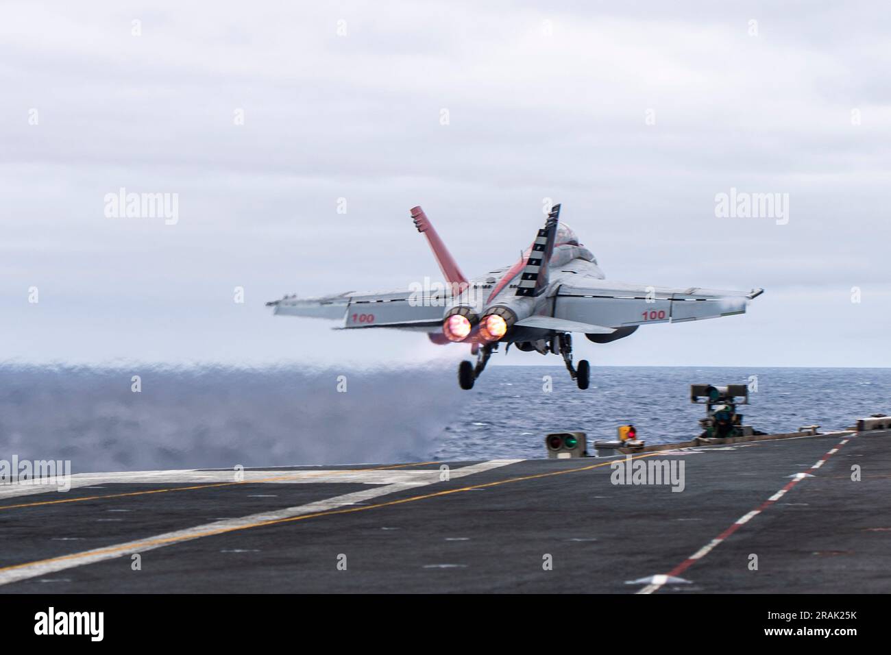 USS Nimitz, United States. 27 June, 2023. A U.S. Navy F/A-18F Super Horner fighter aircraft from the Fighting Redcocks of Strike Fighter Squadron 22, launches on the flight deck of the Nimitz-class aircraft carrier USS Nimitz underway conducting routine operations, June 27, 2023 on the Pacific Ocean. Credit: MC2 Samuel Osborn/U.S Navy Photo/Alamy Live News Stock Photo