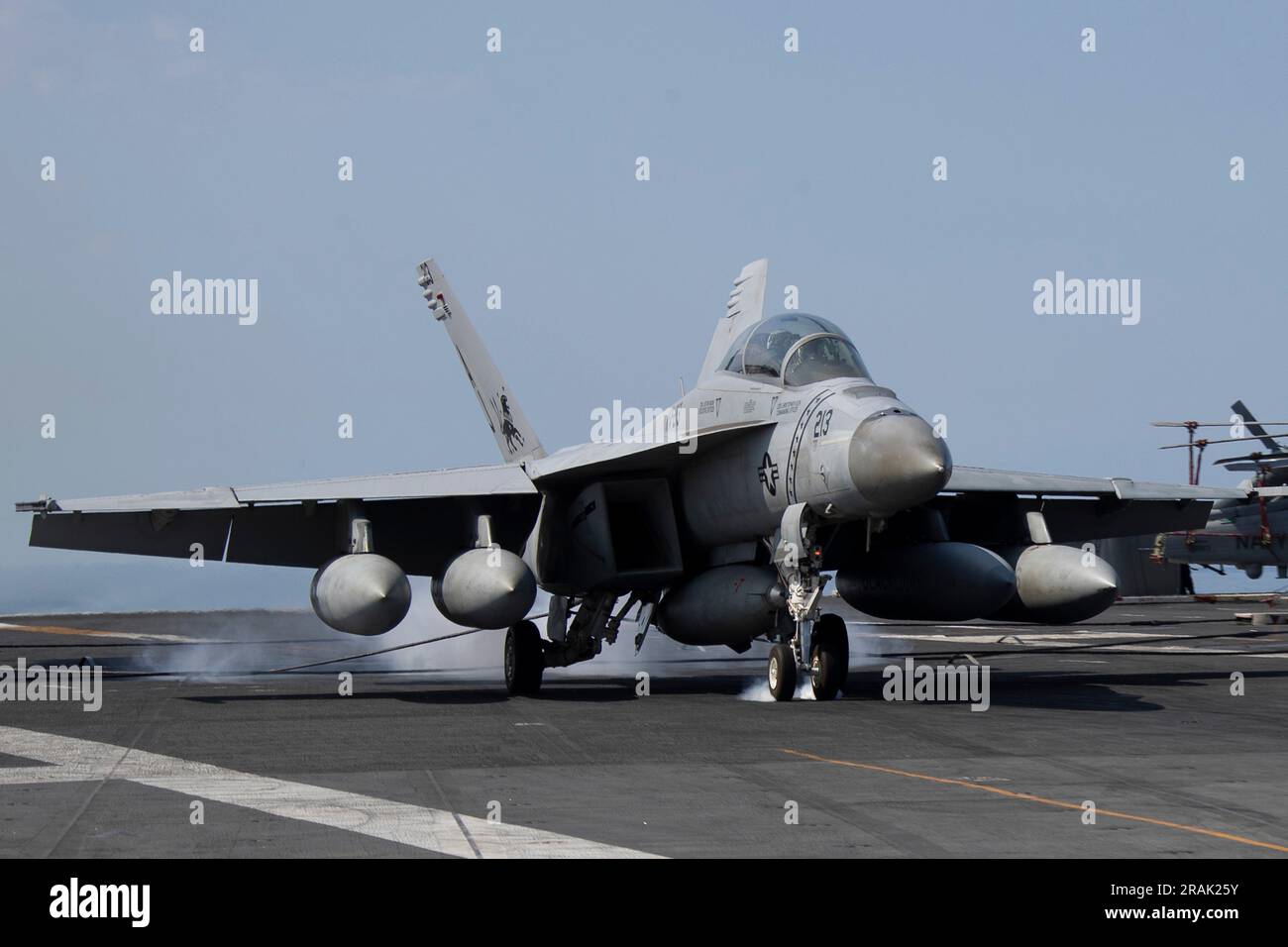 Mediterranean Sea, International Waters. 30 June, 2023. A U.S. Navy F/A-18F Super Hornet fighter jet, attached to the Black Lions of Strike Fighter Squadron 213, performs an arrested landing on the flight deck aboard the Nimitz-class aircraft carrier USS Gerald R. Ford operating on the Mediterranean Sea, June 30, 2023 off the coast of Italy.  Credit: MC3 Simon Pike/U.S. Navy Photo/Alamy Live News Stock Photo
