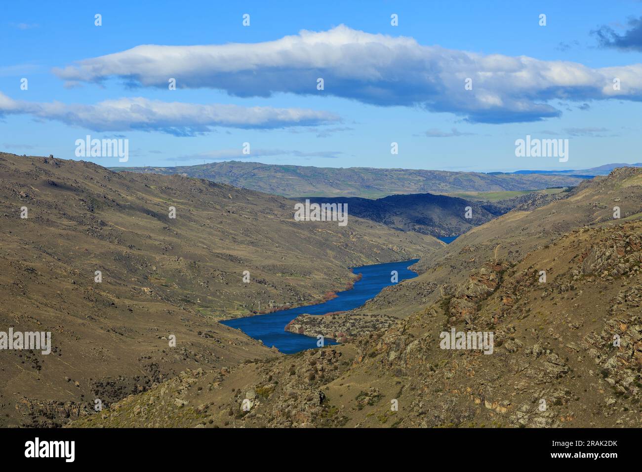 The Clutha River winding through the stark landscape of Central Otago in the South Island of New Zealand Stock Photo