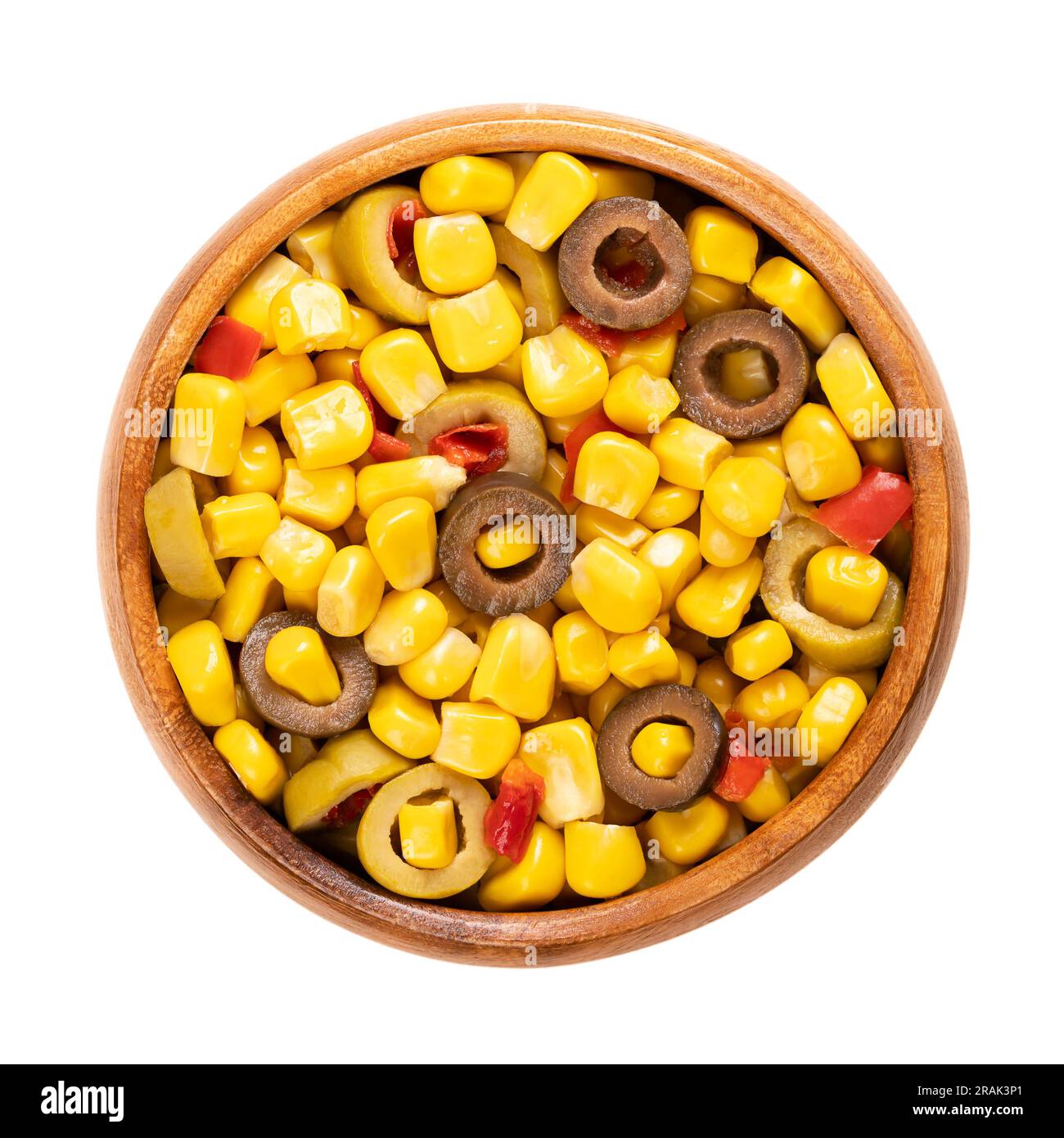 Mix of canned corn, sliced green and black olives and diced red bell pepper, in a wooden bowl. Ready-to-eat Mediterranean maize mix, as a side dish. Stock Photo
