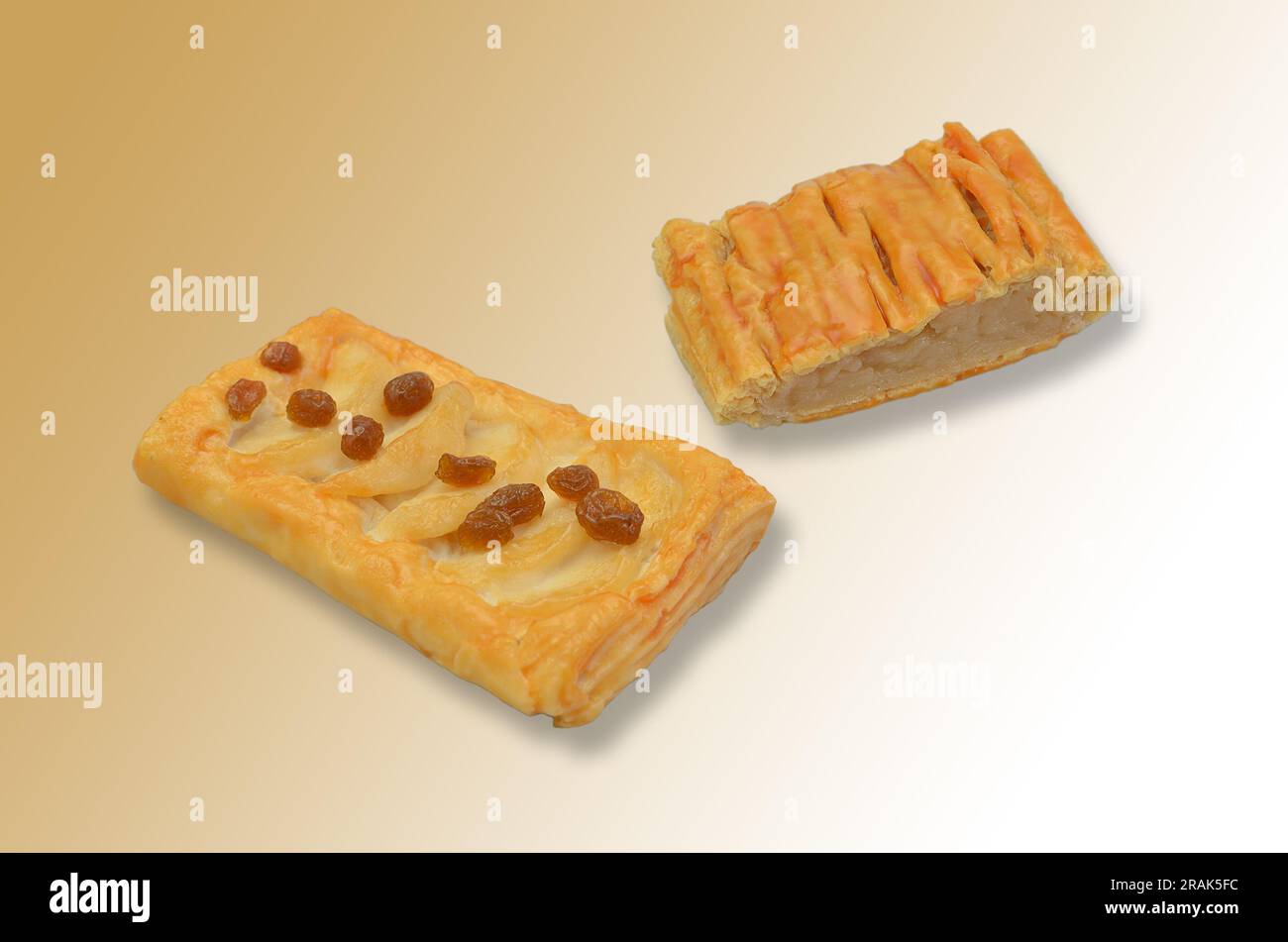 two pieces of apple pie on light brown background with colour gradient, close up Stock Photo