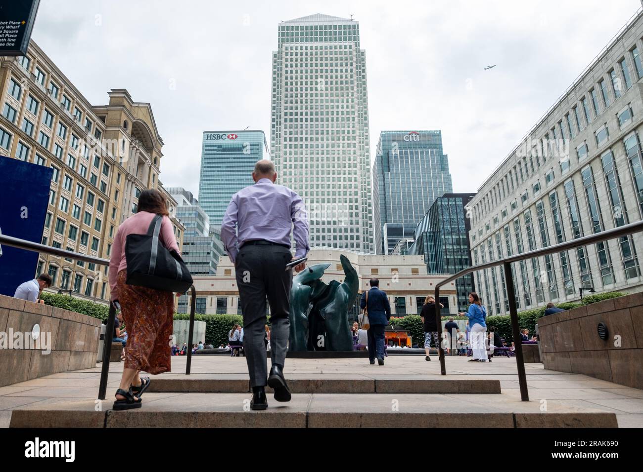 London- June 2023: Canary Wharf buildings and office worker- Major London financial centre Stock Photo