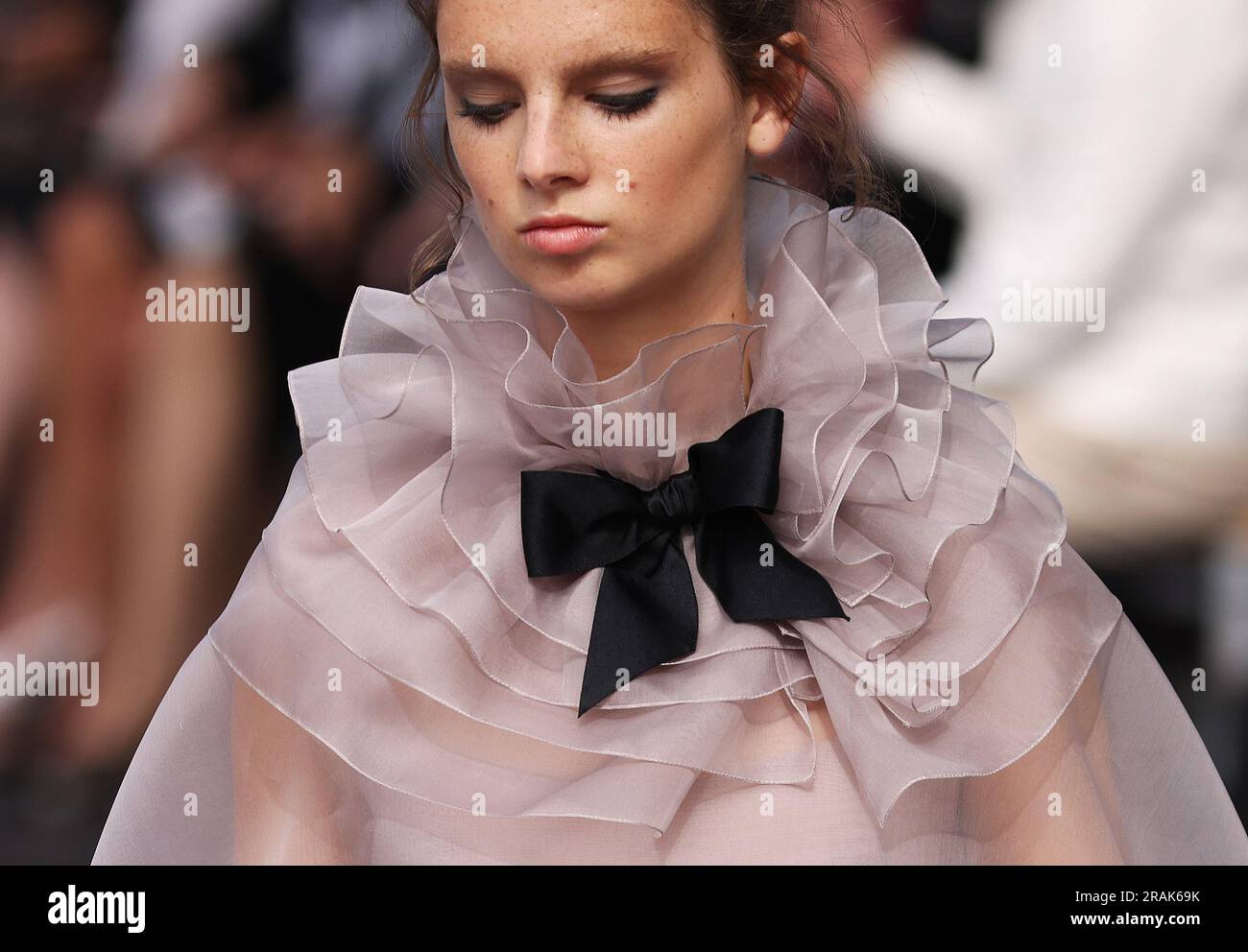 Paris, France. 4th July, 2023. A model presents a creation of French