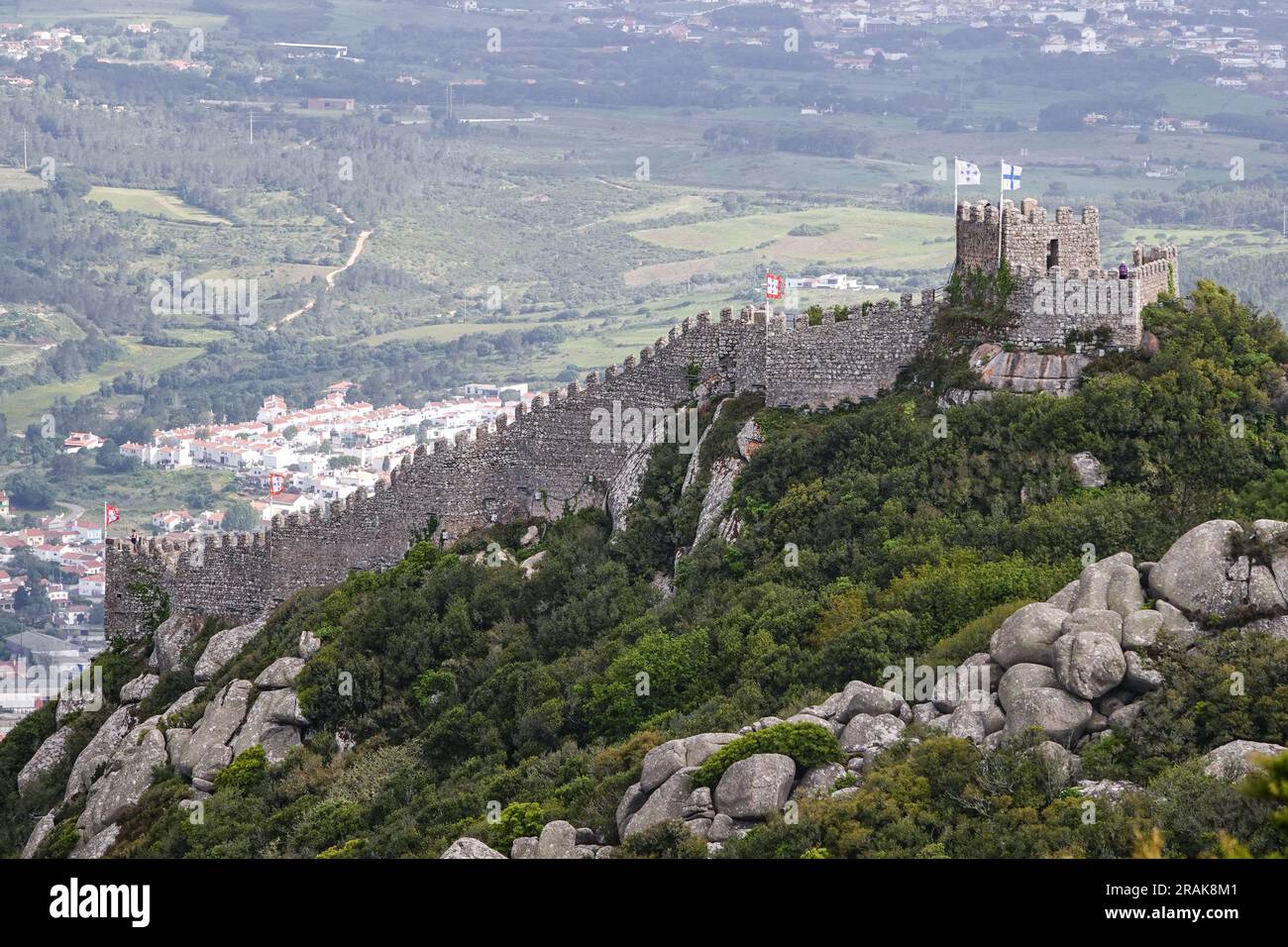 The Castelo dos Mouros, or Castle of the Moors on the Sintra Hills above the historic town of Sintra, Portugal. The medieval castle built during the Moorish occupation in the 8th century dominates the hillside over Sintra. Stock Photo