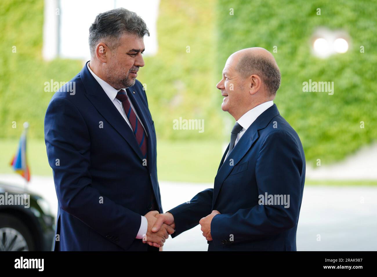German Chancellor Olaf Scholz, right, welcomes Romanian Prime Minister ...