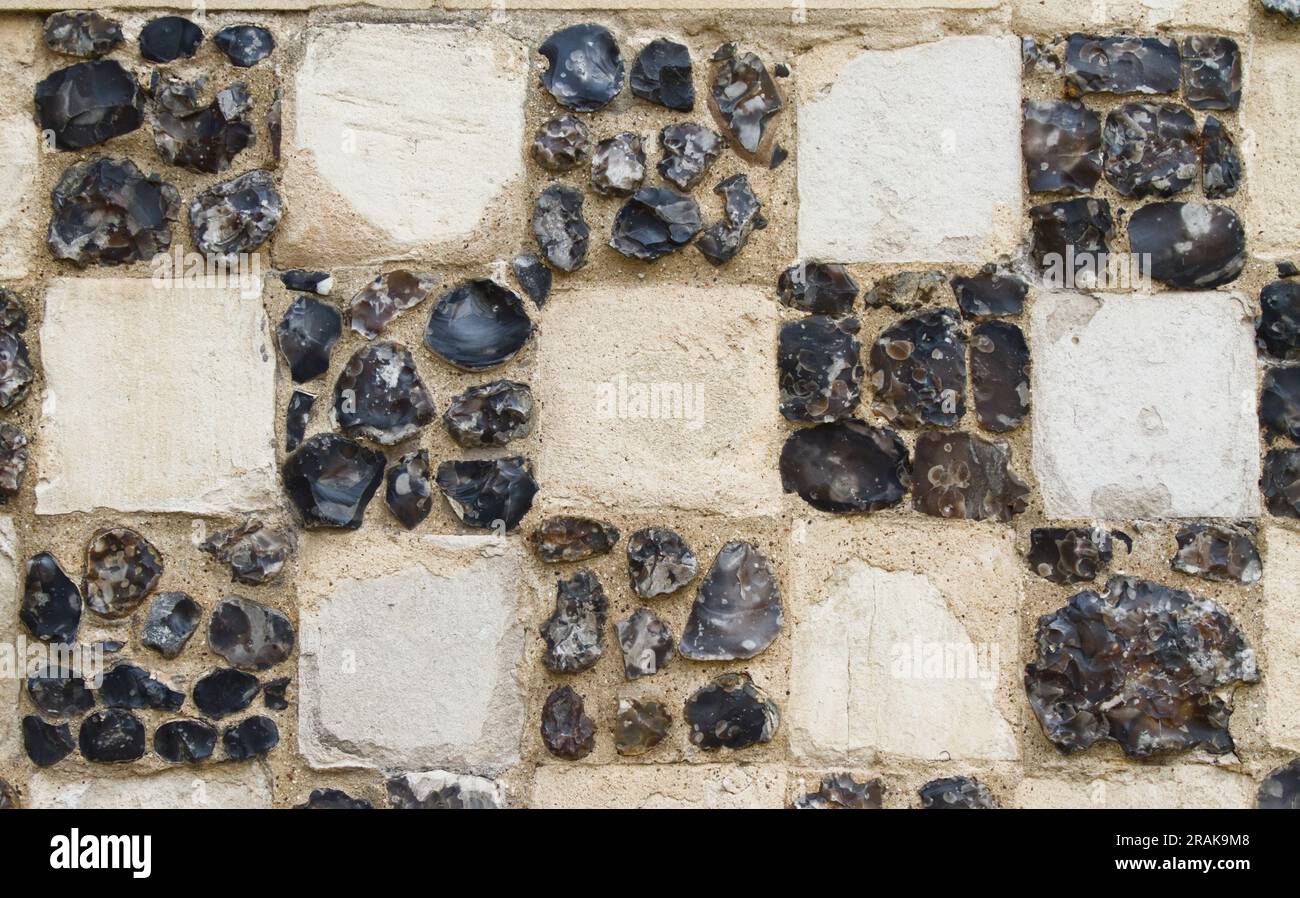 Detail Of The Checkerwork Flushwork Of Flints And Stone Of The Wall Of The 15th Century Town Hall Of King's Lynn, England UK Stock Photo